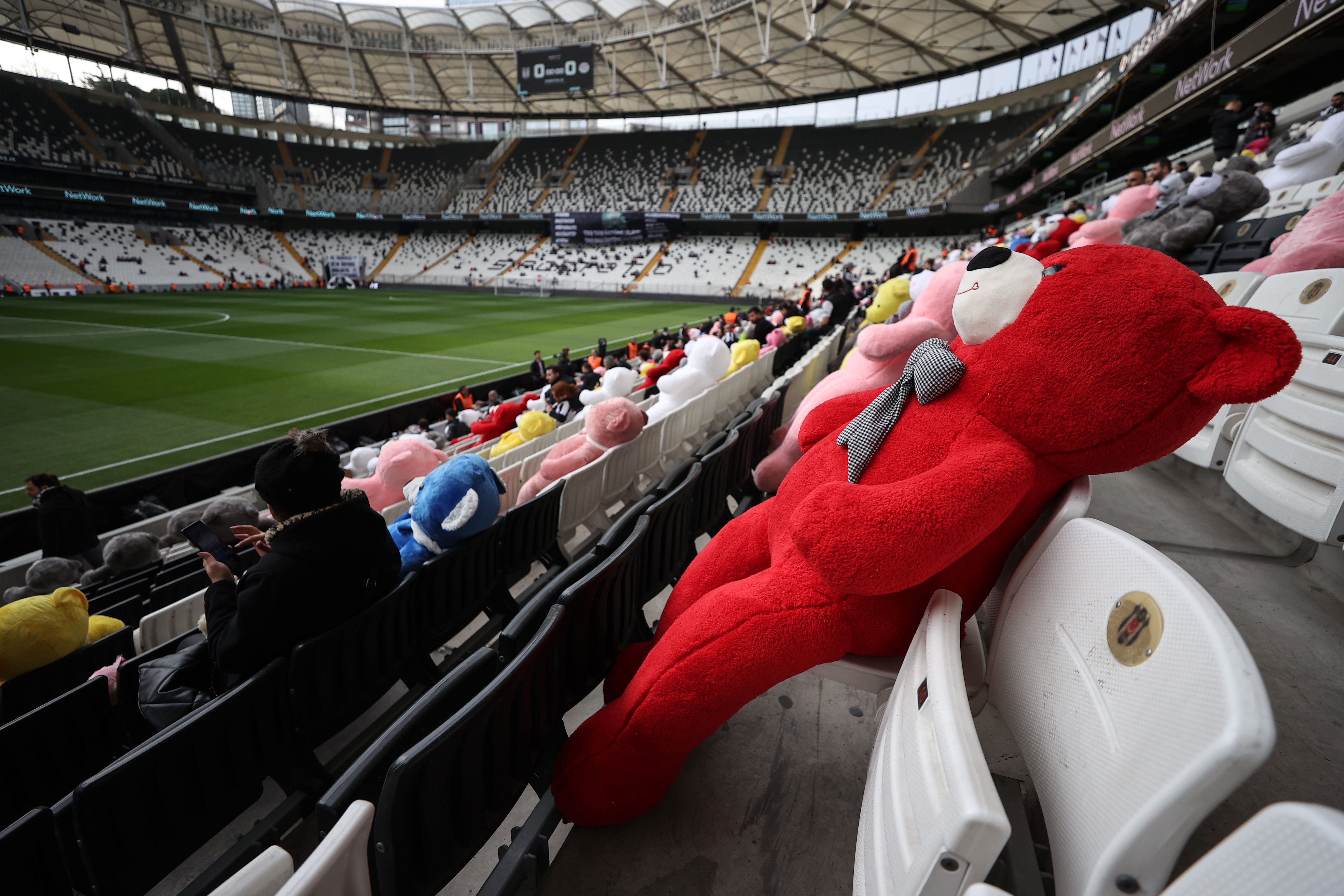 Fans throw toys onto the pitch during the Turkish Super League football match