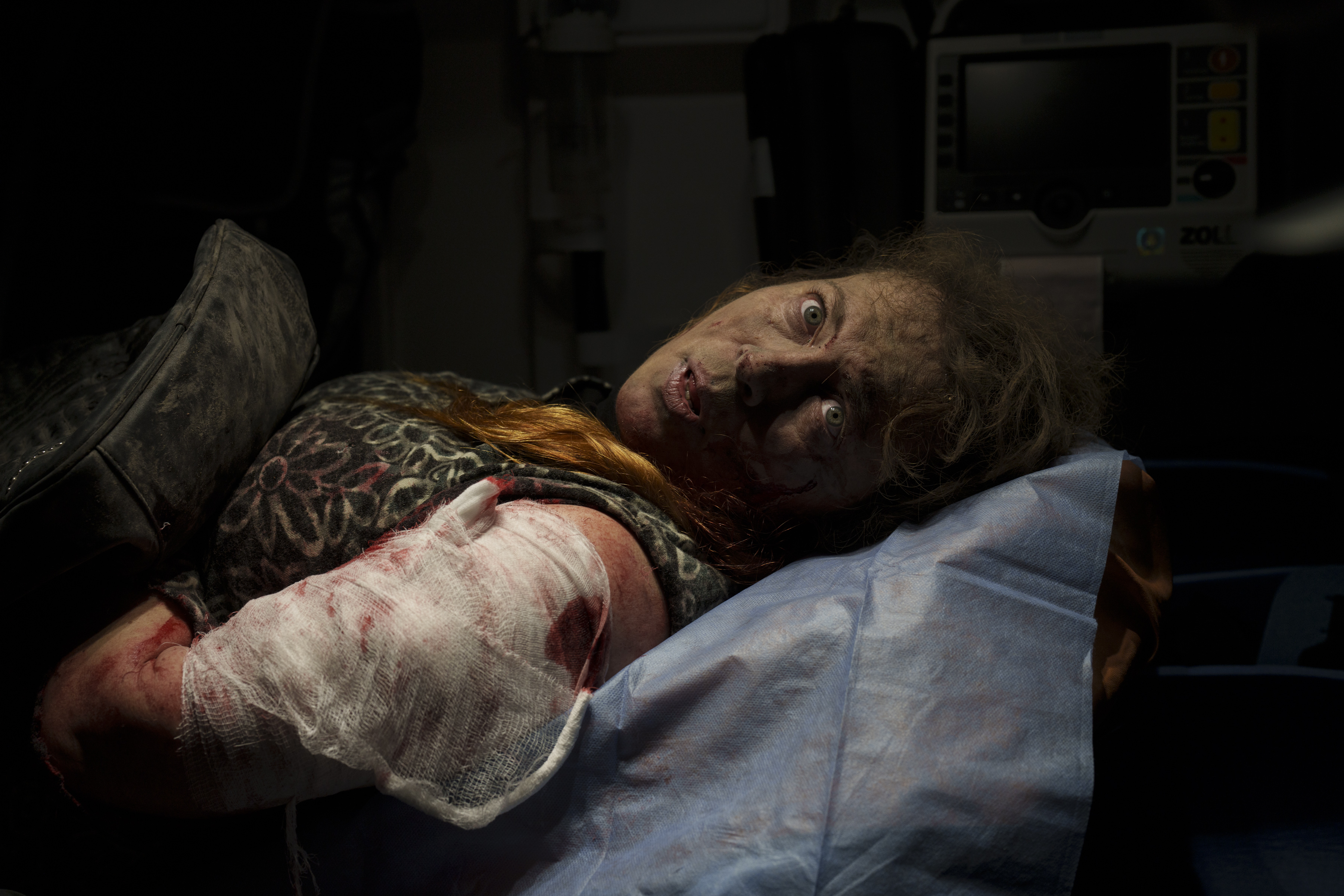 A resident wounded after a Russian attack lies inside an ambulance before being taken to a hospital in Kherson, southern Ukraine