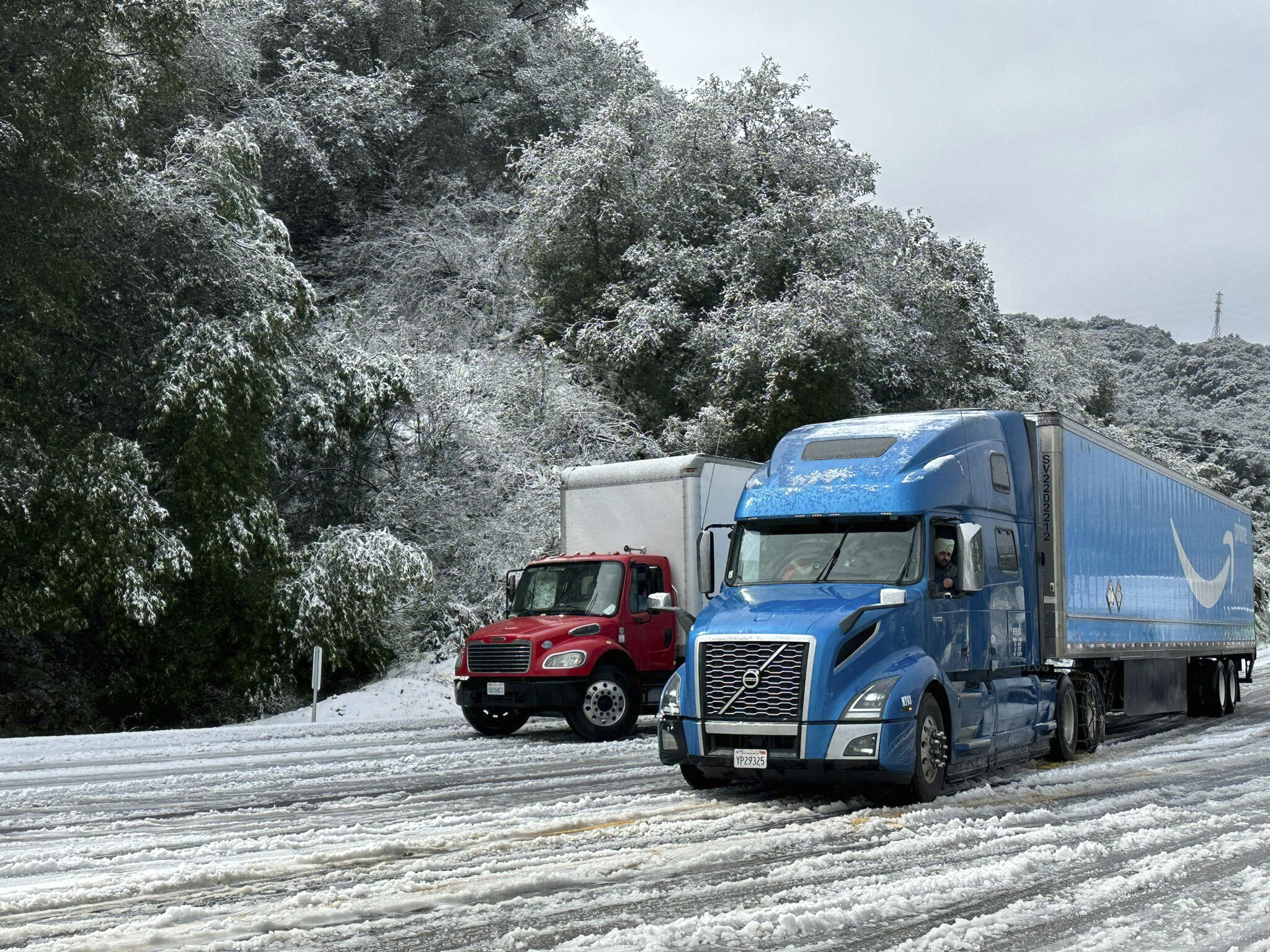 Trucks drive in the snow 