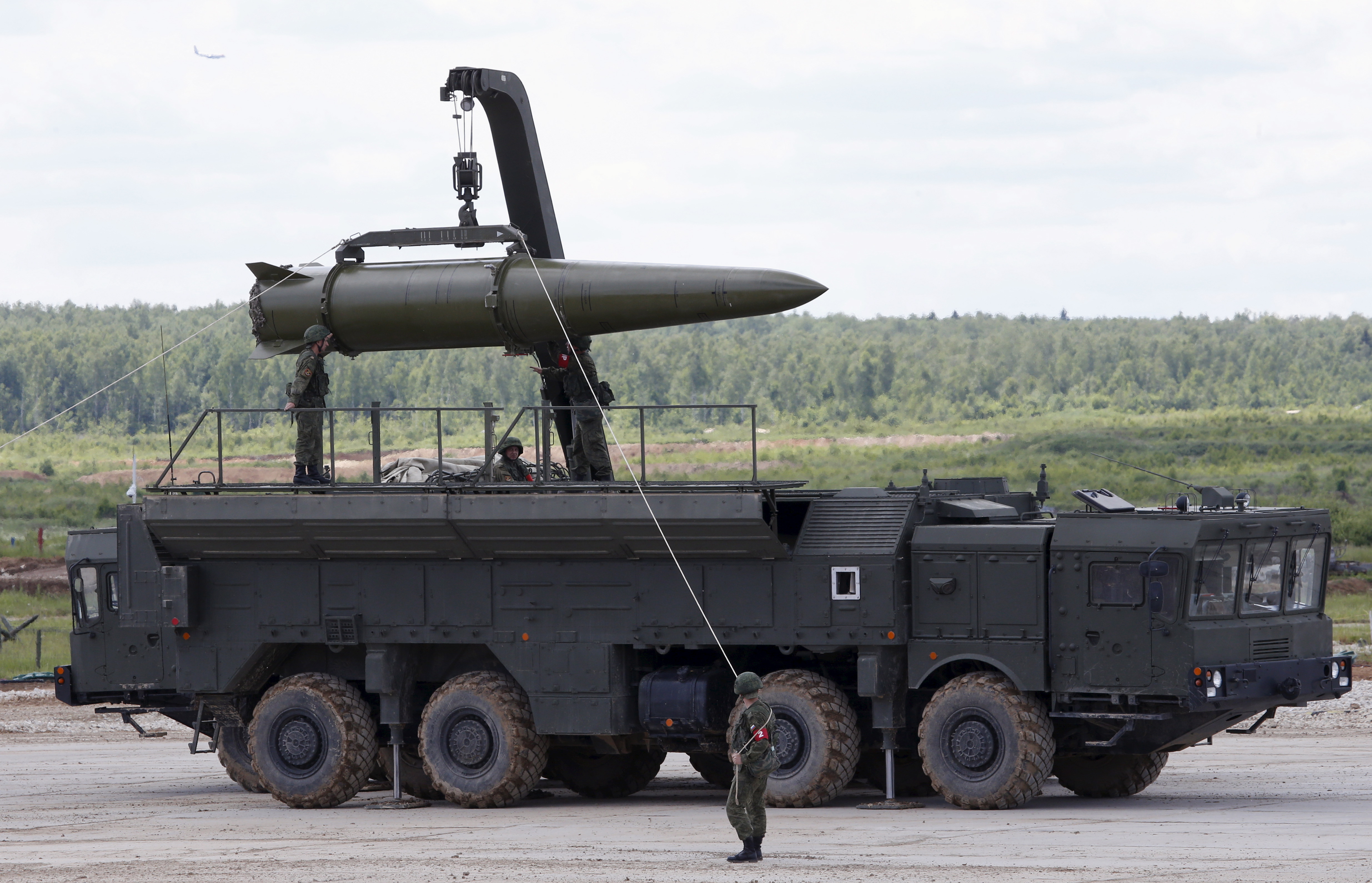 Russian servicemen equip an Iskander tactical missile system at the Army-2015 international military-technical forum in Kubinka, outside Moscow