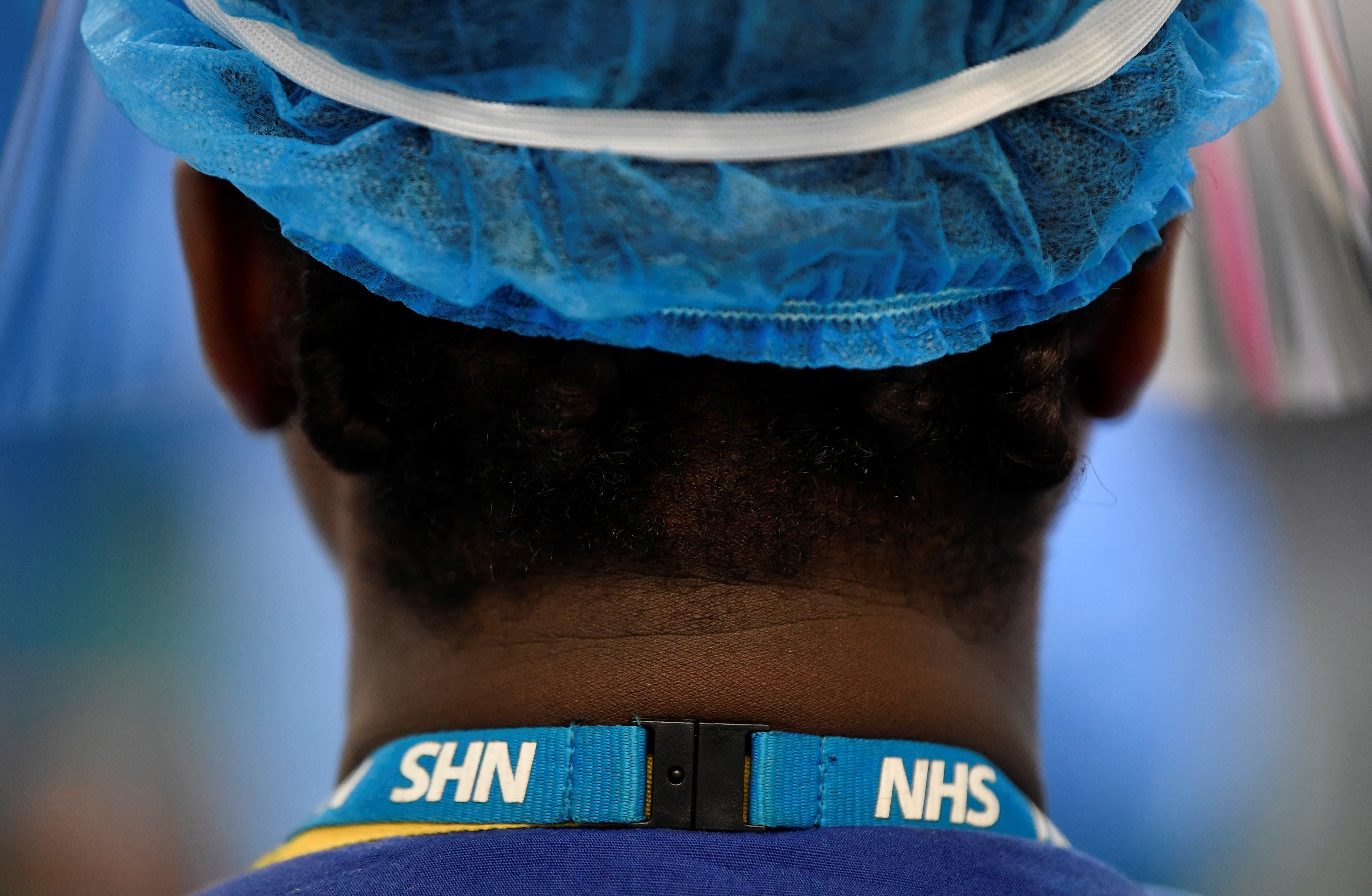 Detail is seen on a lanyard of a nurse on a COVID-19 ward at Milton Keynes University Hospital, amid the spread of the coronavirus disease (COVID-19) pandemic, Milton Keynes, Britain, January 20, 2021. Picture taken January 20, 2021. REUTERS/Toby Melville