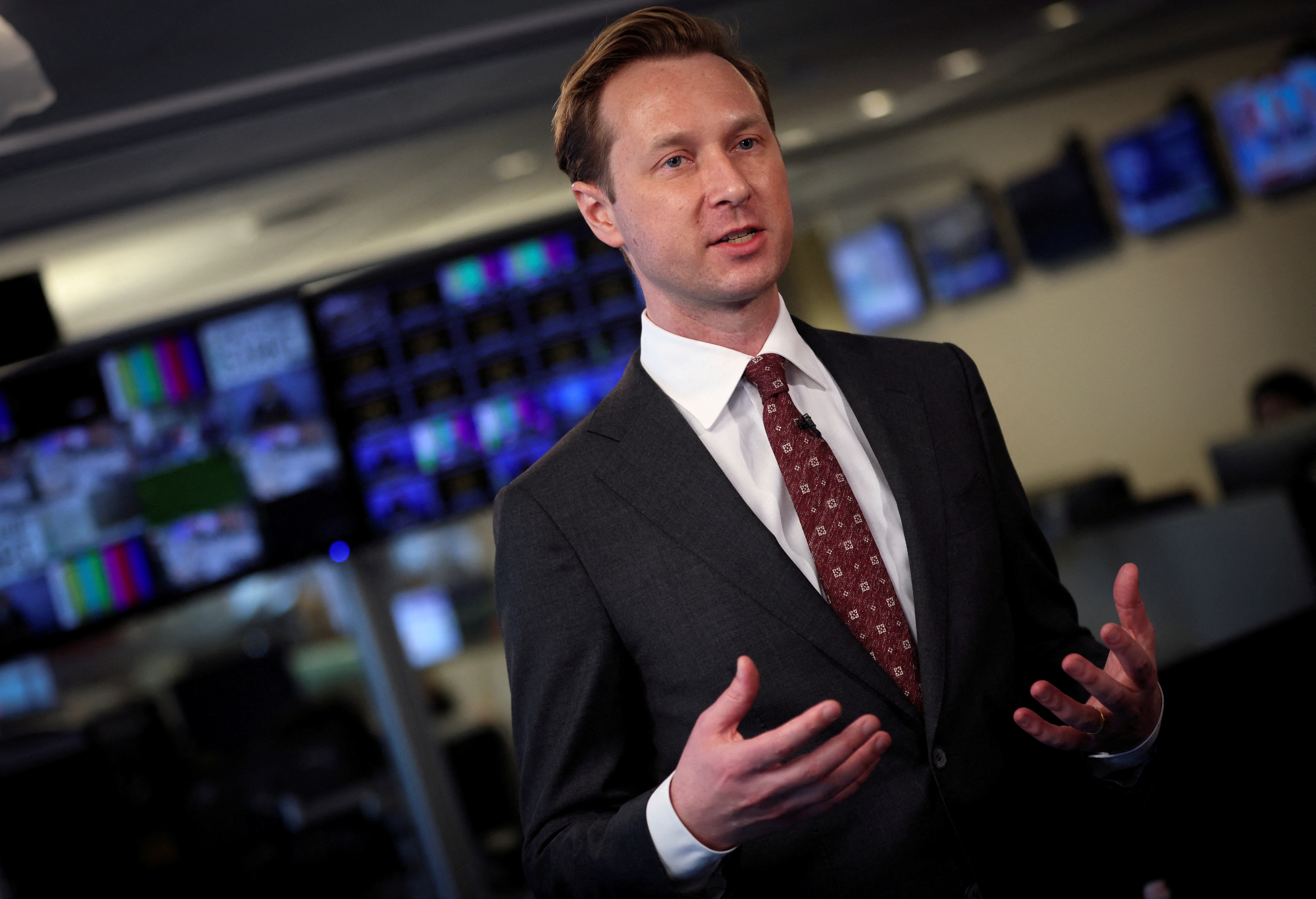 Andrew Adams speaks in an interview with Reuters in 2022