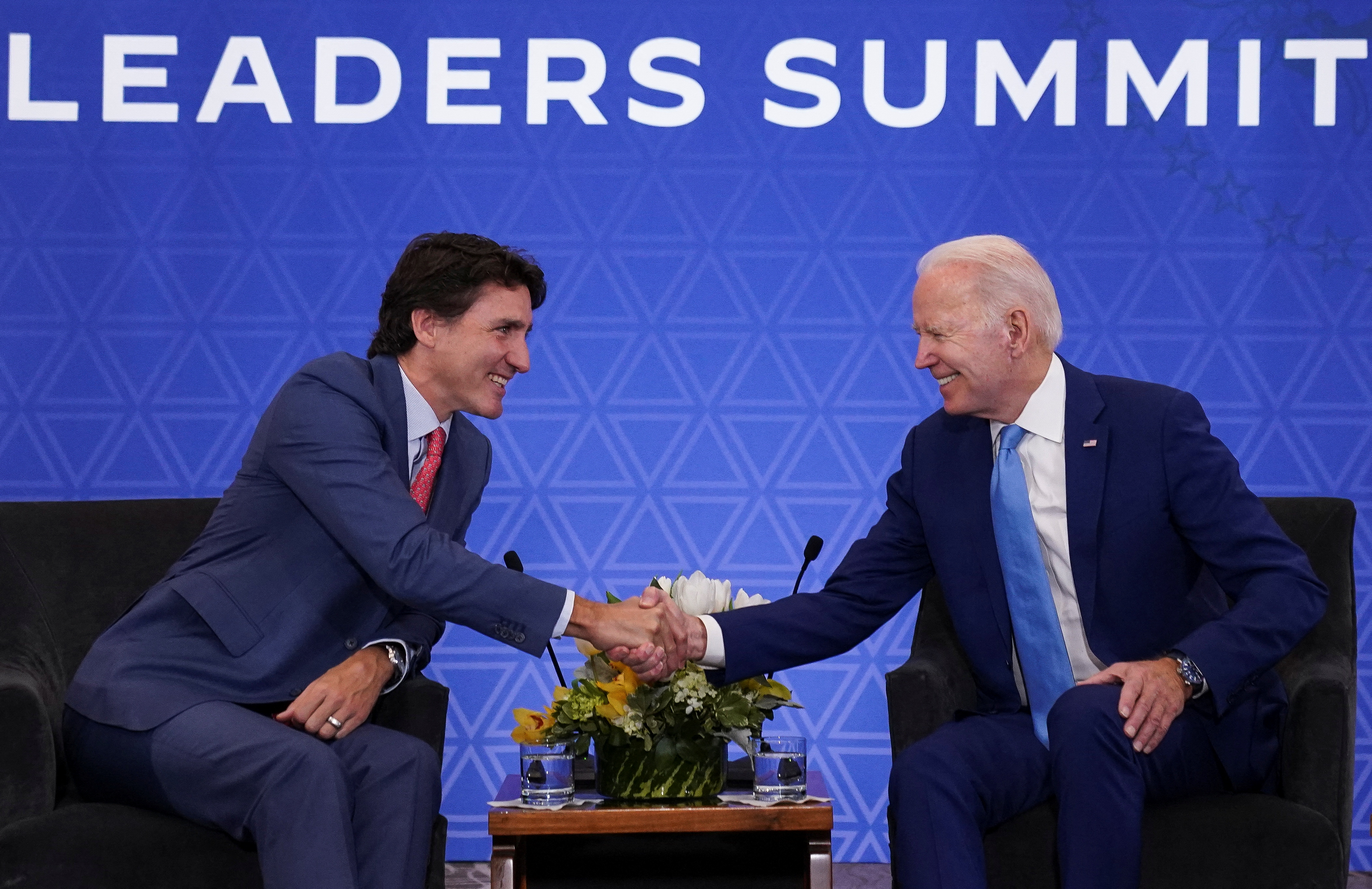 Canadian Prime Minister Justin Trudeau shakes hands with US President Joe Biden in Mexico City