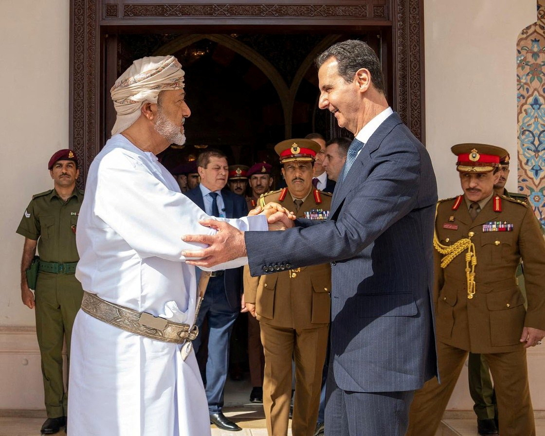 Oman's Sultan Haitham bin Tariq shakes hands with Syrian President Bashar al-Assad during his first trip abroad since the devastating earthquake in Syria
