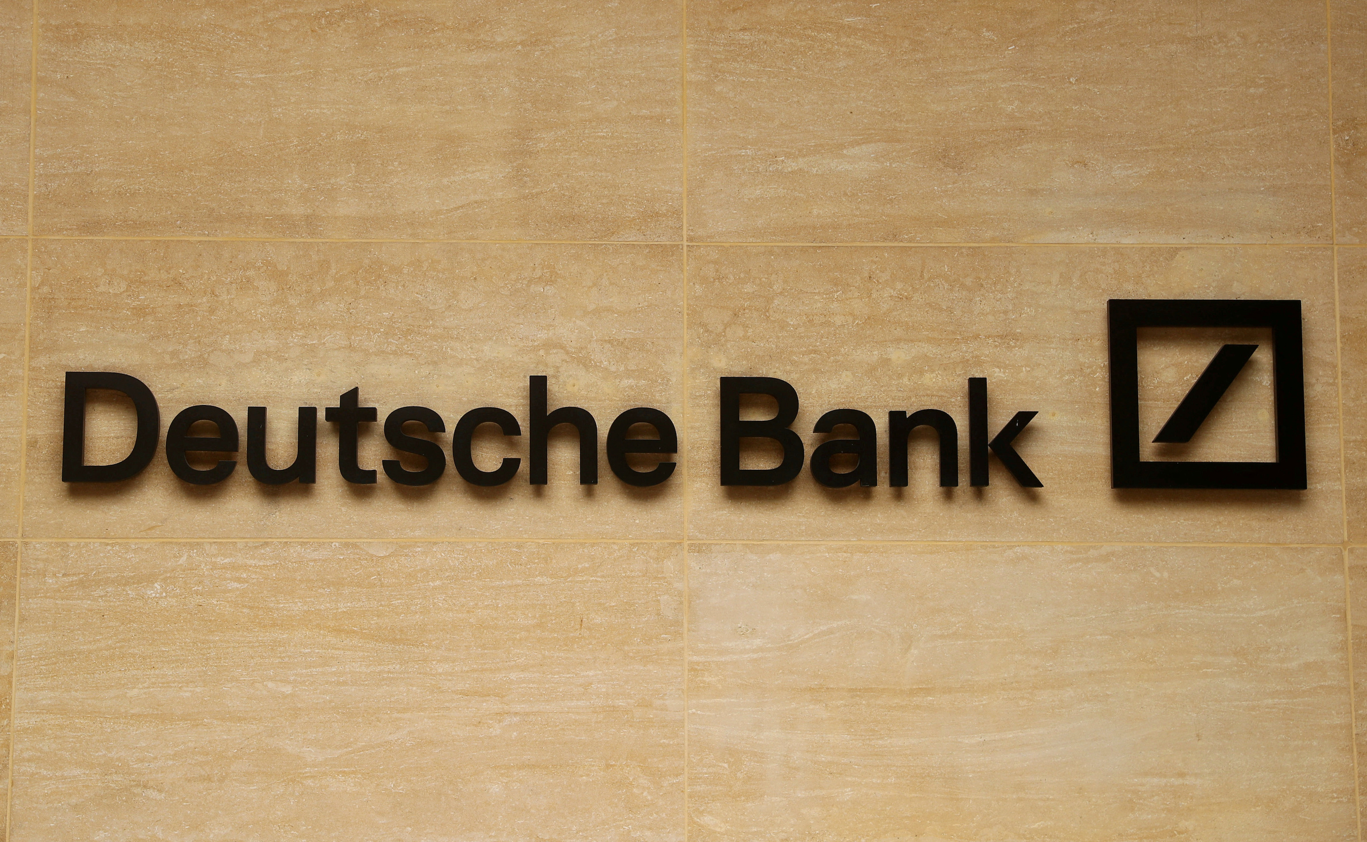 The logo of Deutsche Bank is pictured on a company's office in London, Britain.