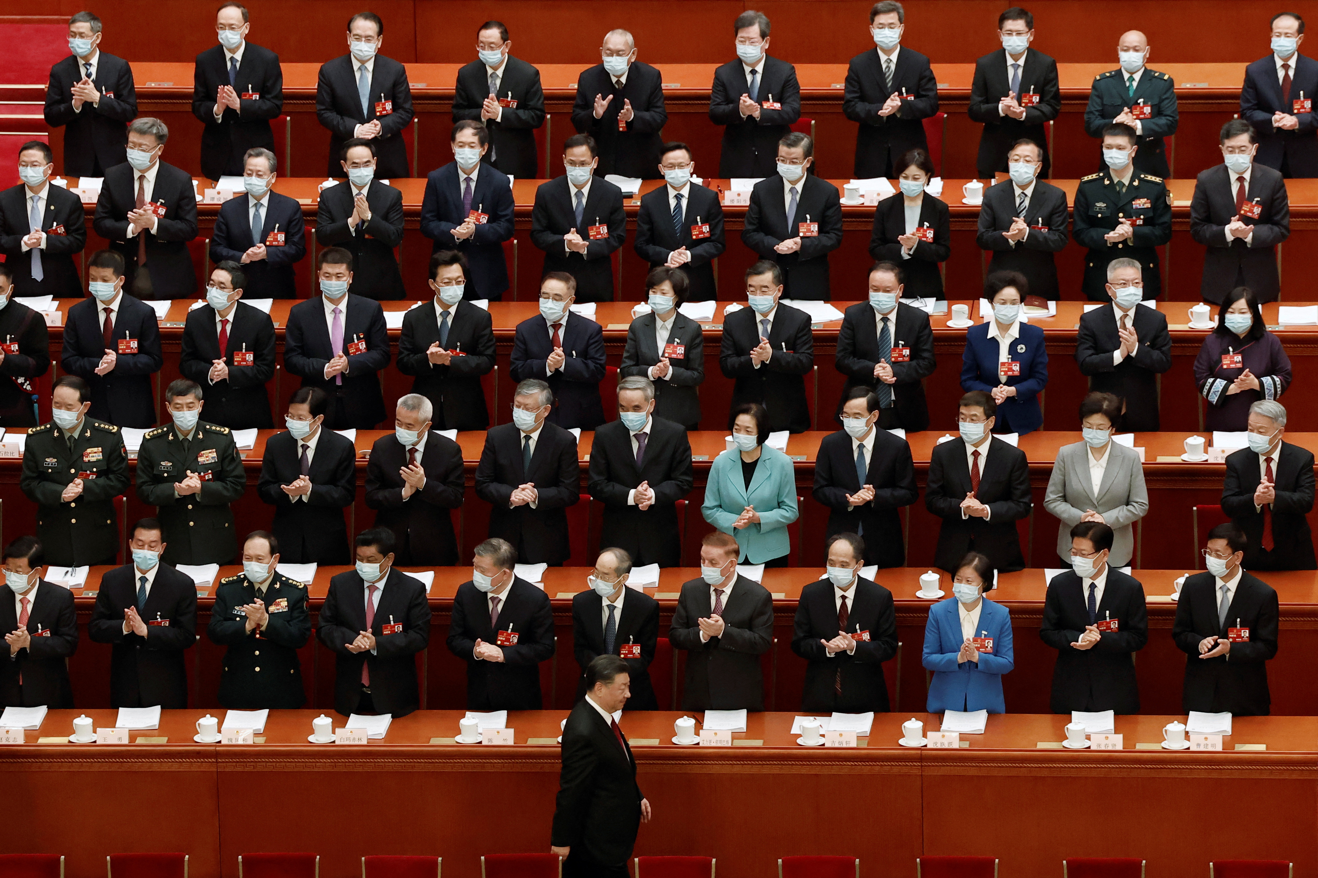 Chinese President Xi Jinping arrives for the opening session of the National People's Congress. He walks past hundreds of delegates to the Congress.
