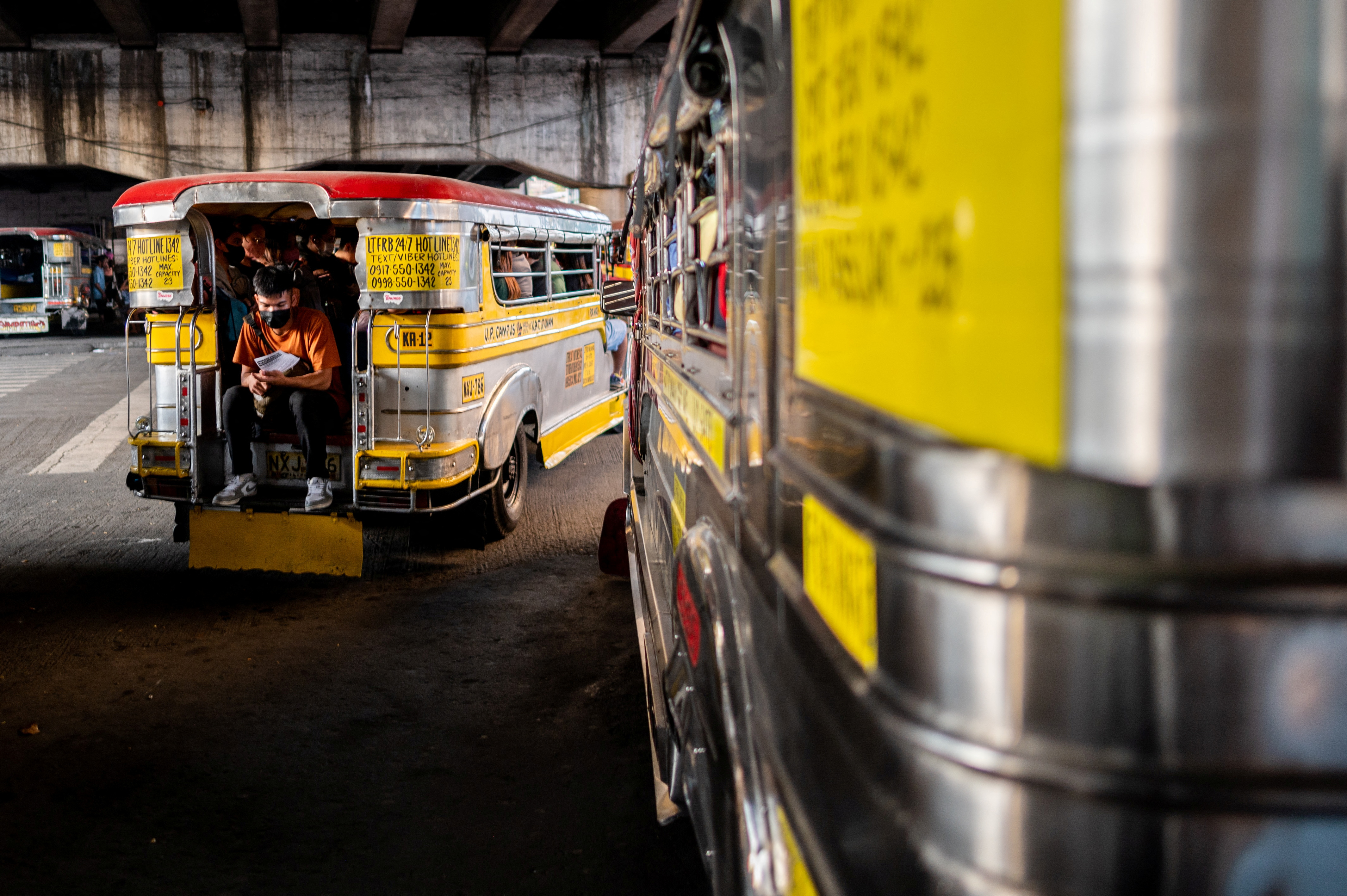 The rear and side view of two jeepneys