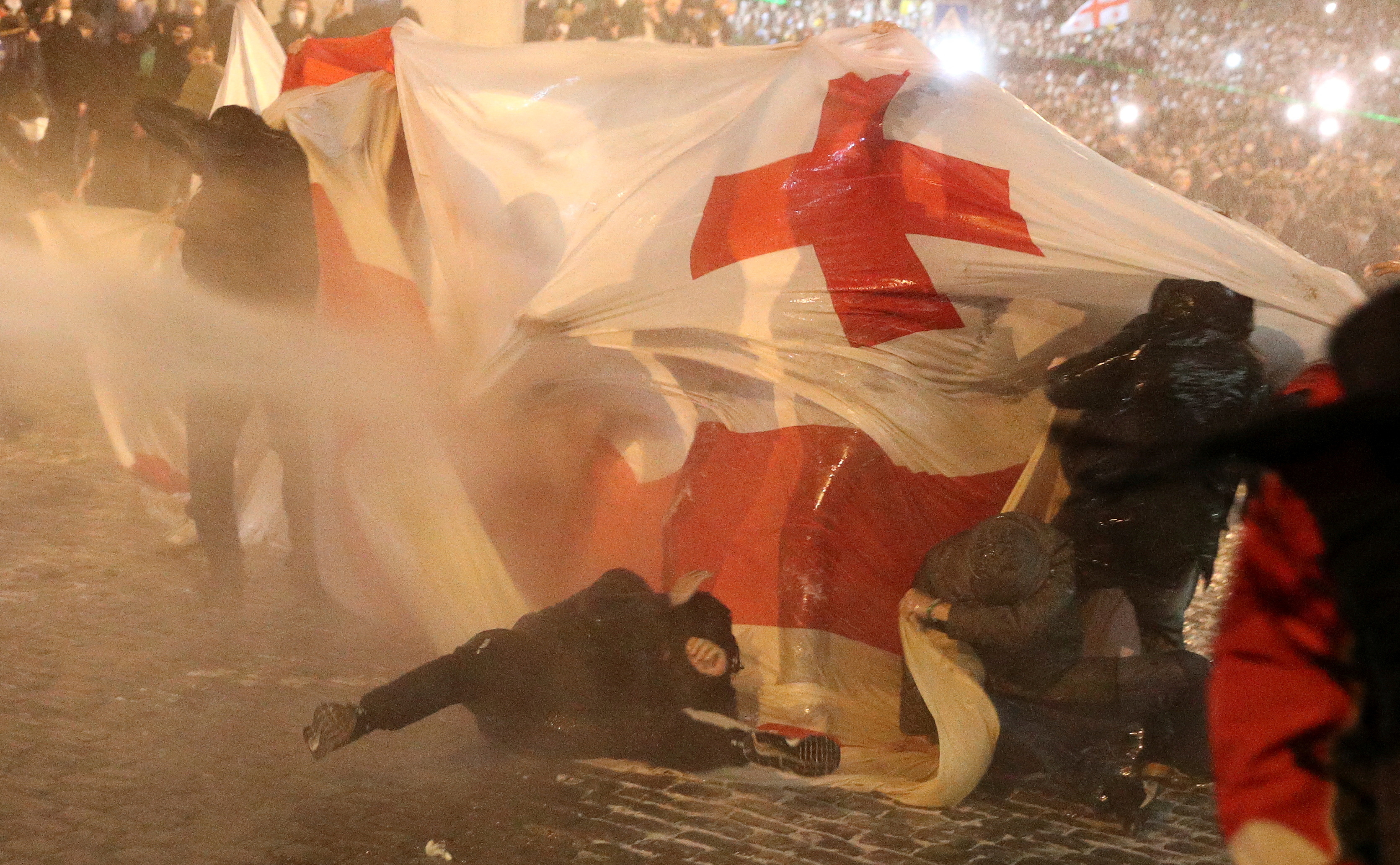 Police use a water cannon to disperse protesters in Tbilisi