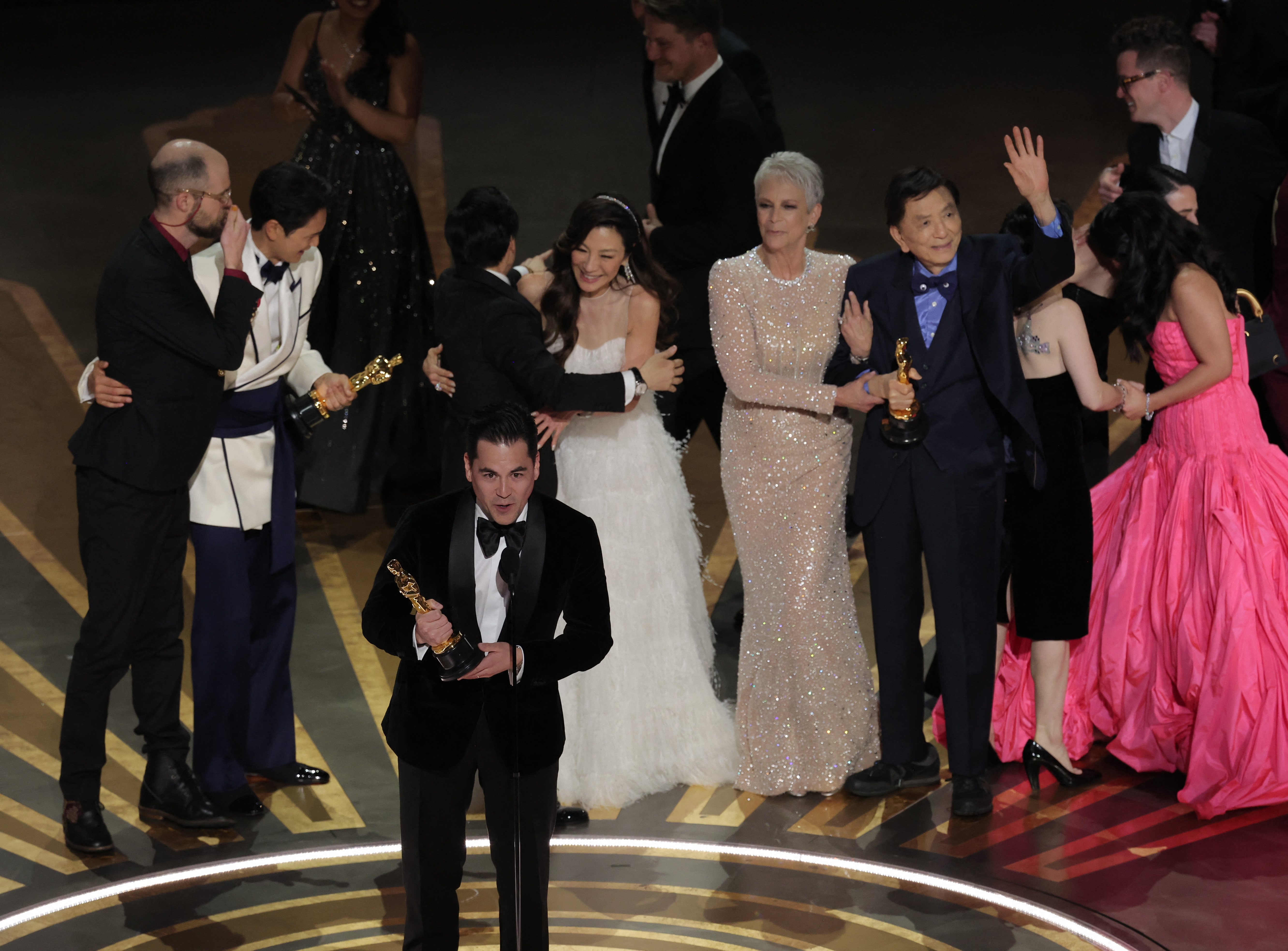 Daniel Kwan, Daniel Scheinert and Jonathan Wang win the Oscar for Best Picture for "Everything Everywhere All at Once" during the Oscars show at the 95th Academy Awards in Hollywood