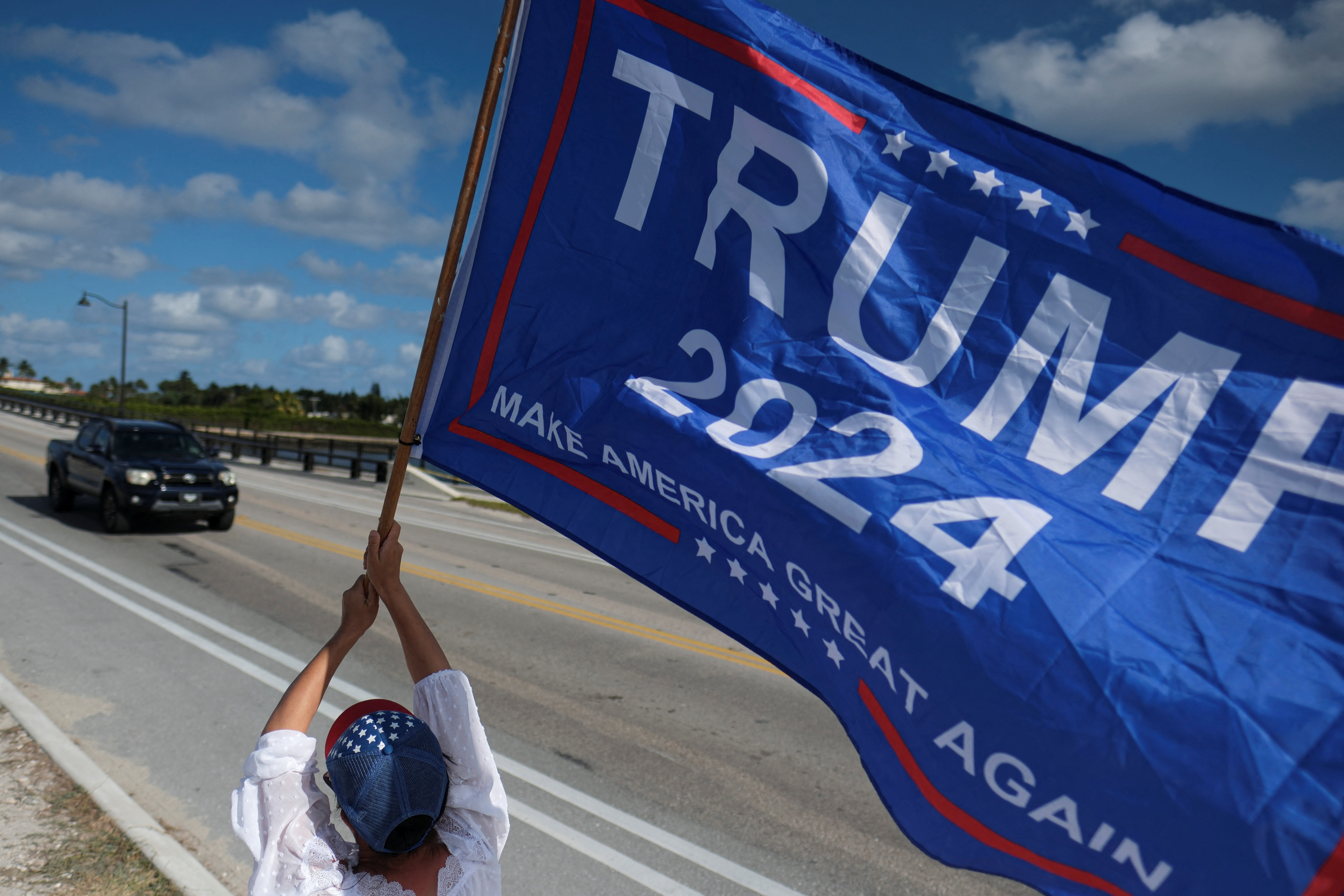 A supporter of former U.S. President Donald Trump attends a gathering outside his Mar-a-Lago resort