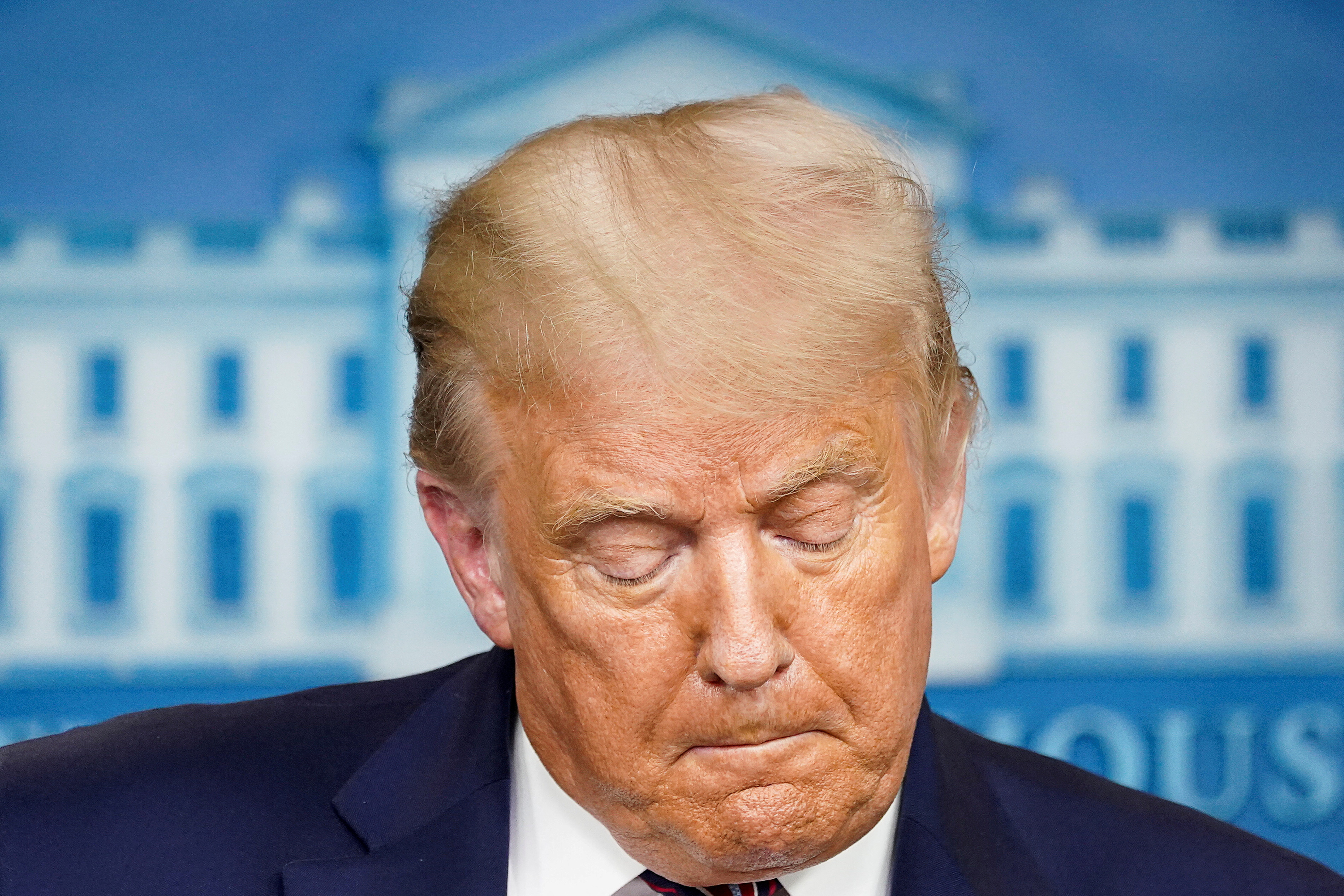U.S. President Donald Trump pauses as he speaks during a briefing on the coronavirus disease (COVID-19) pandemic response at the White House in Washington