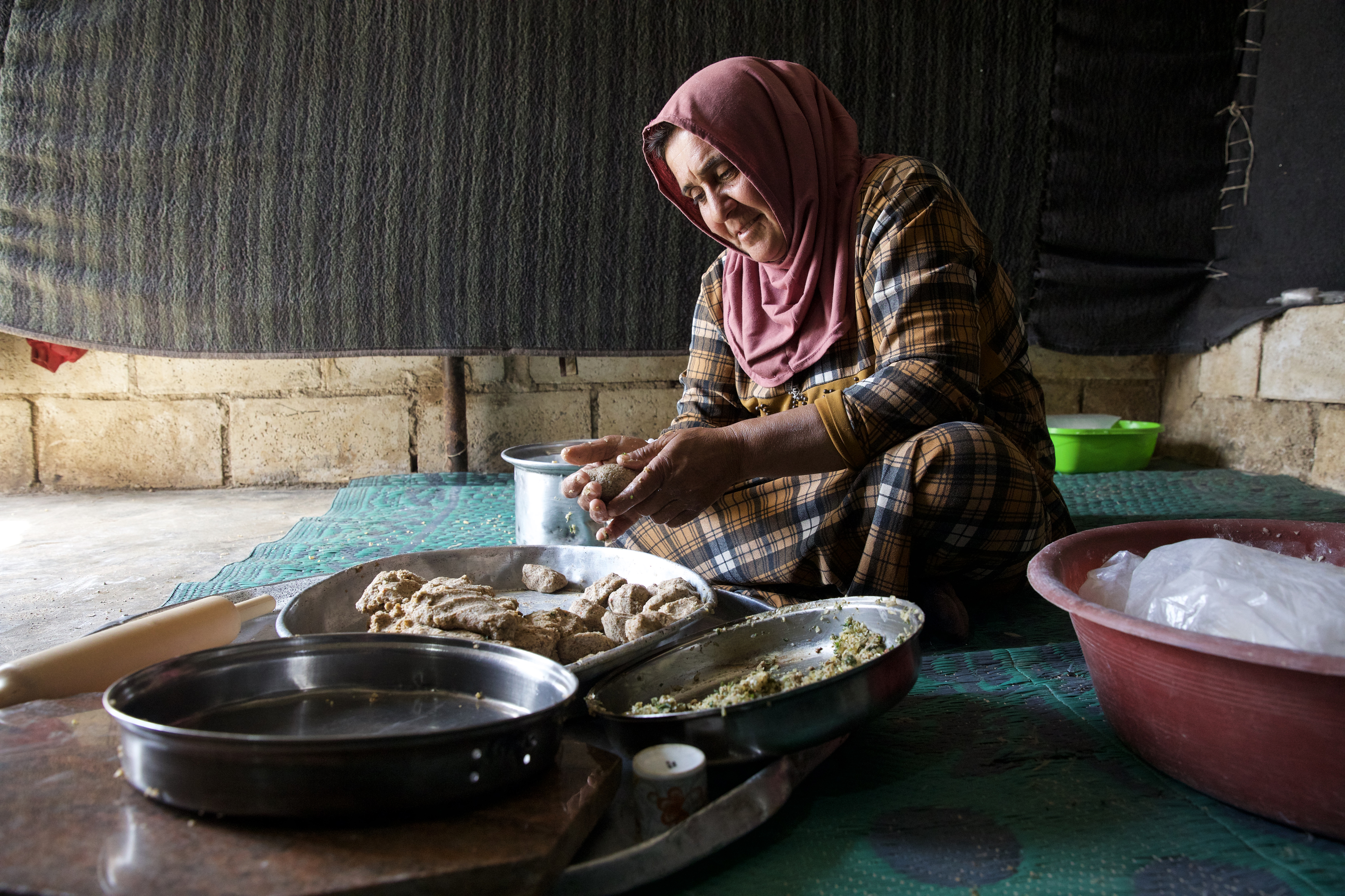 Fateem shaping the kibbe shells
