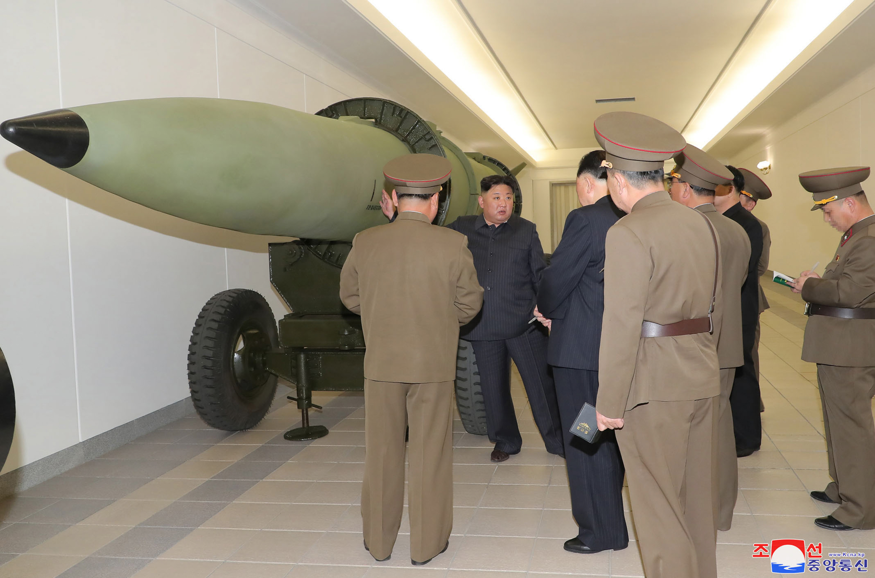 North Korean leader Kim Jong Un inspects a nuclear weaponisation project at an unknown location in North Korea.