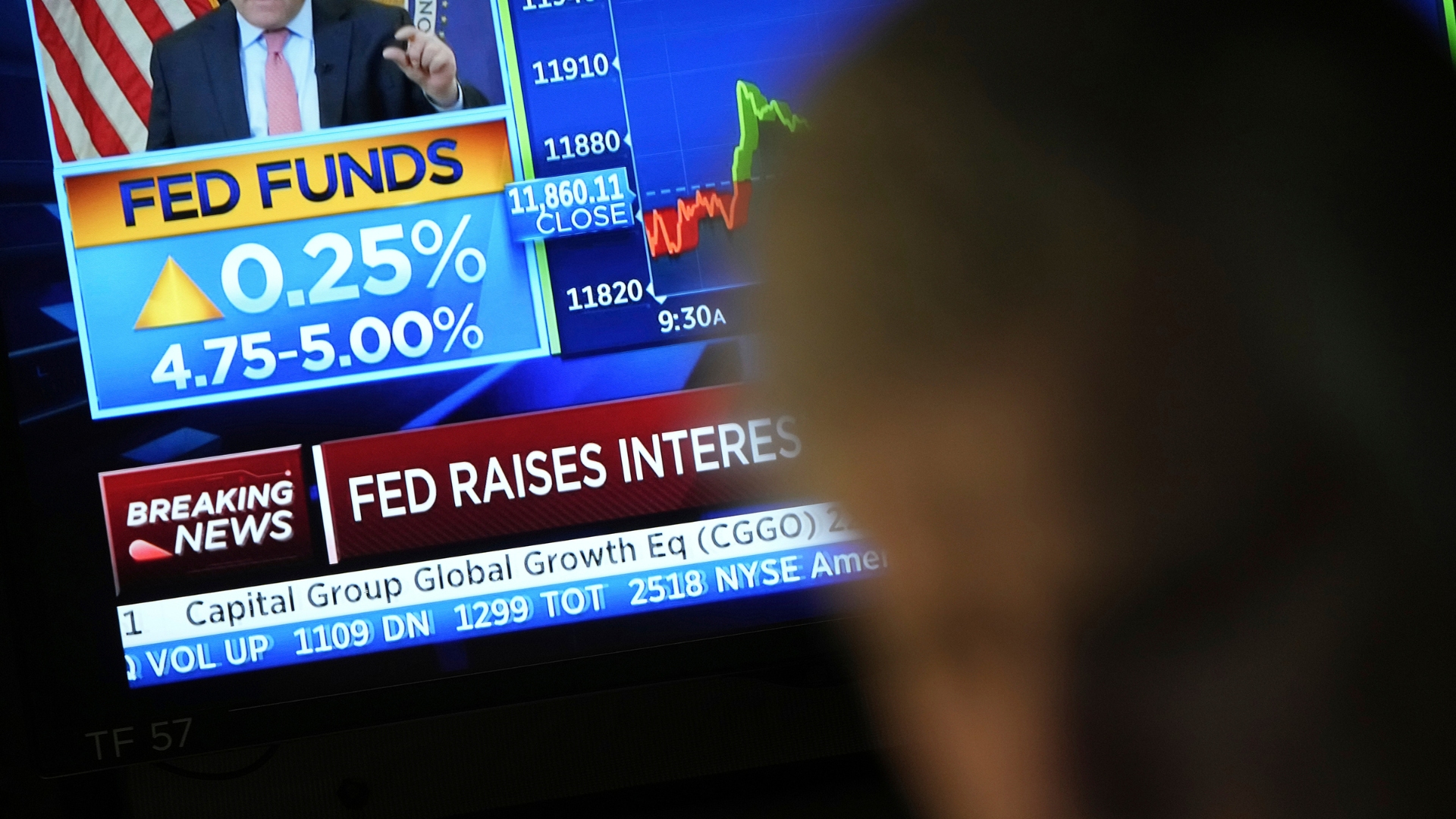 News on a Federal Reserve interest rate hike appears on a monitor at the New York Stock Exchange