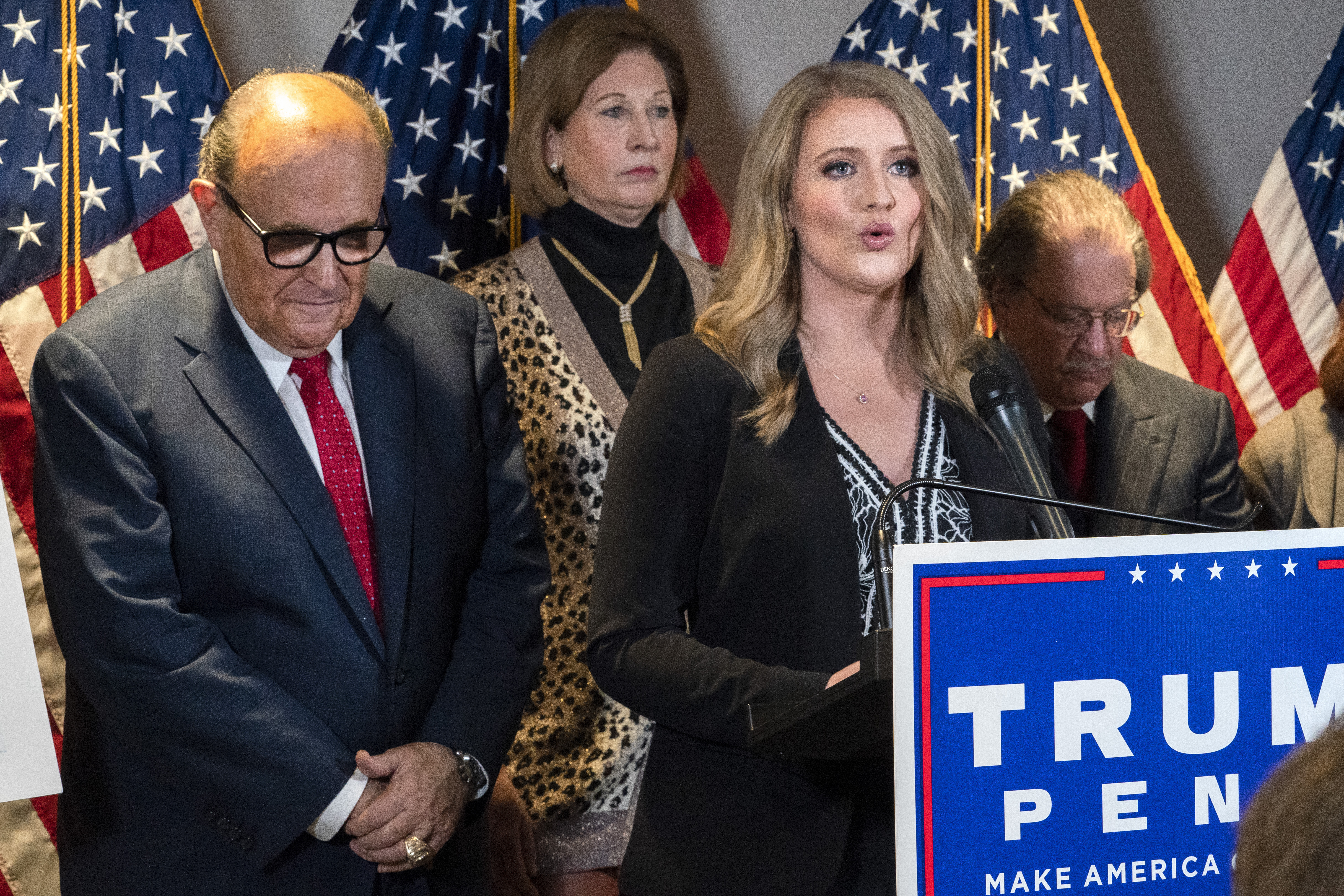Members of President Donald Trump's legal team, including former Mayor of New York Rudy Giuliani, left, Sidney Powell, and Jenna Ellis, speaking, attend a news conference at the Republican National Committee headquarters, Thursday Nov. 19, 2020, in Washington