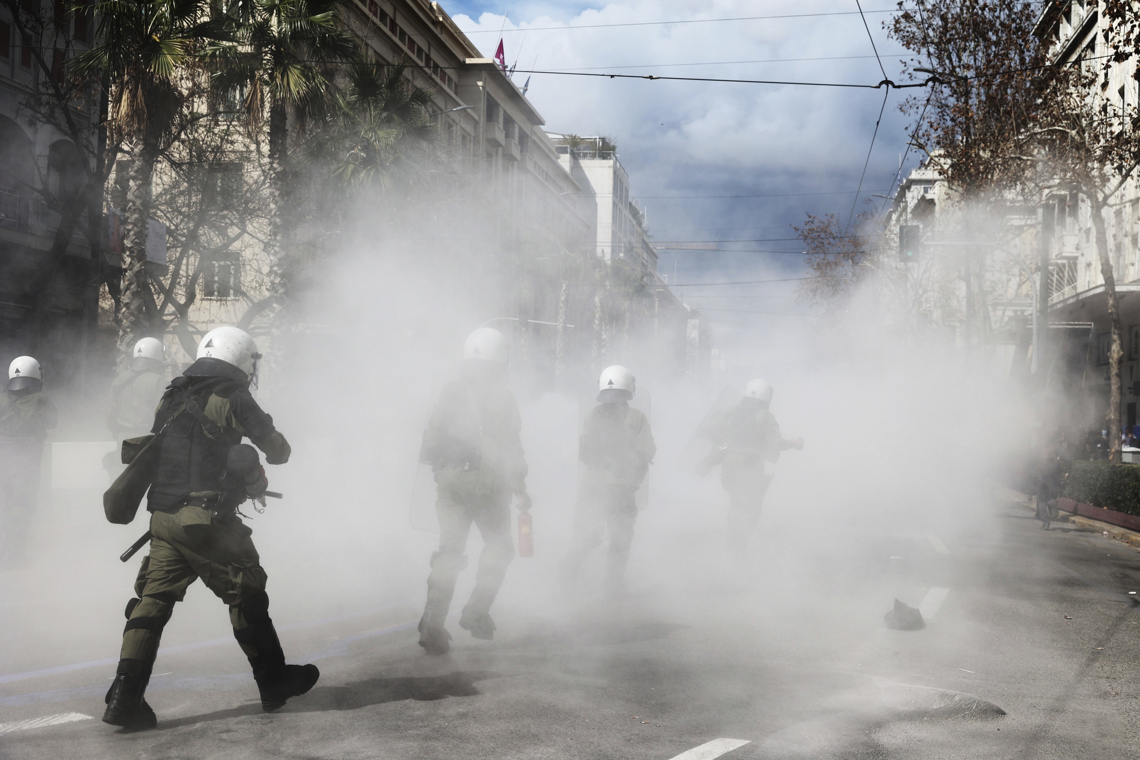 Riot police operate against demonstrators during clashes in Athens, Greece, Sunday, March 5, 2023. 