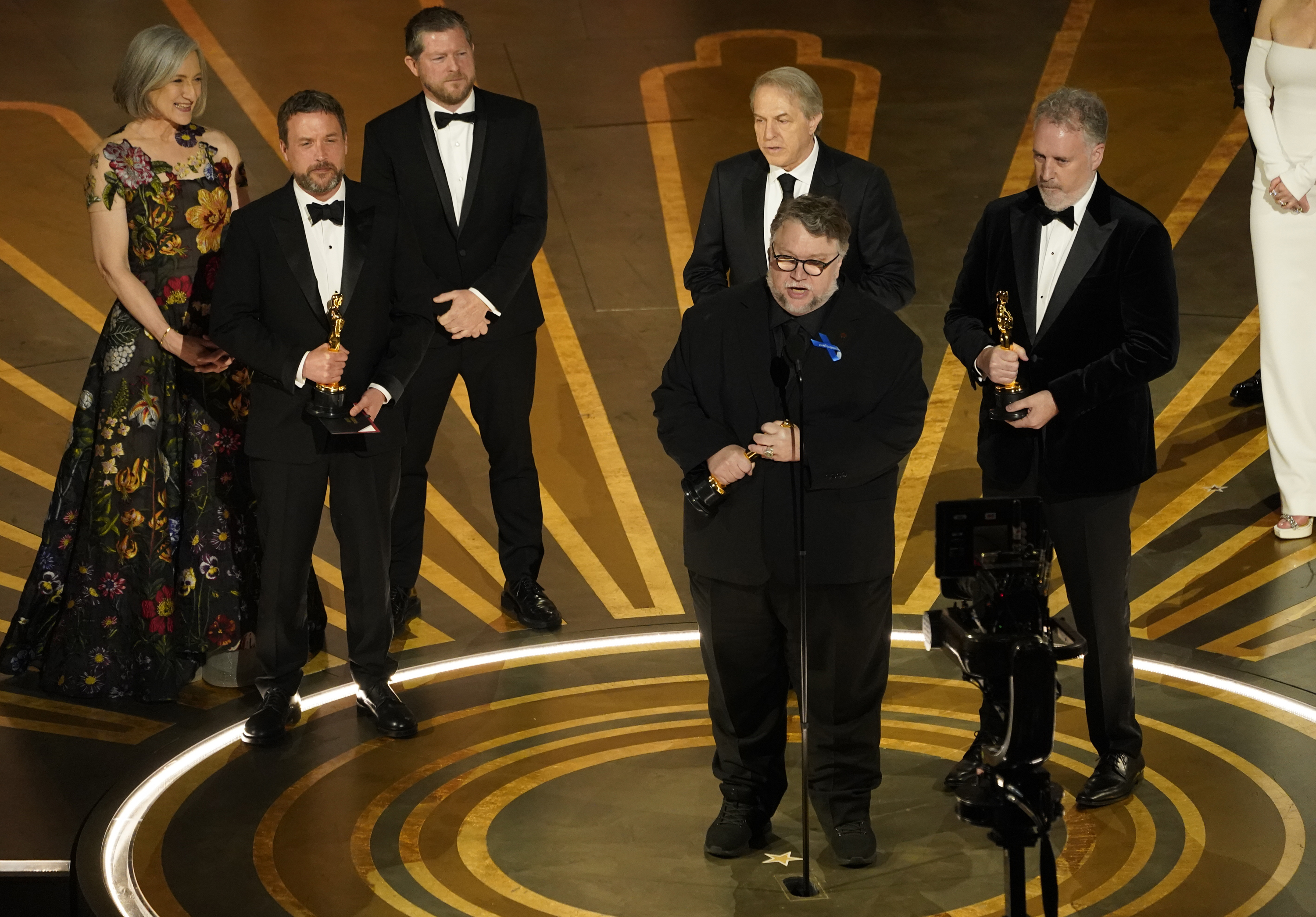 Guillermo del Toro centerstage accepting an Oscar