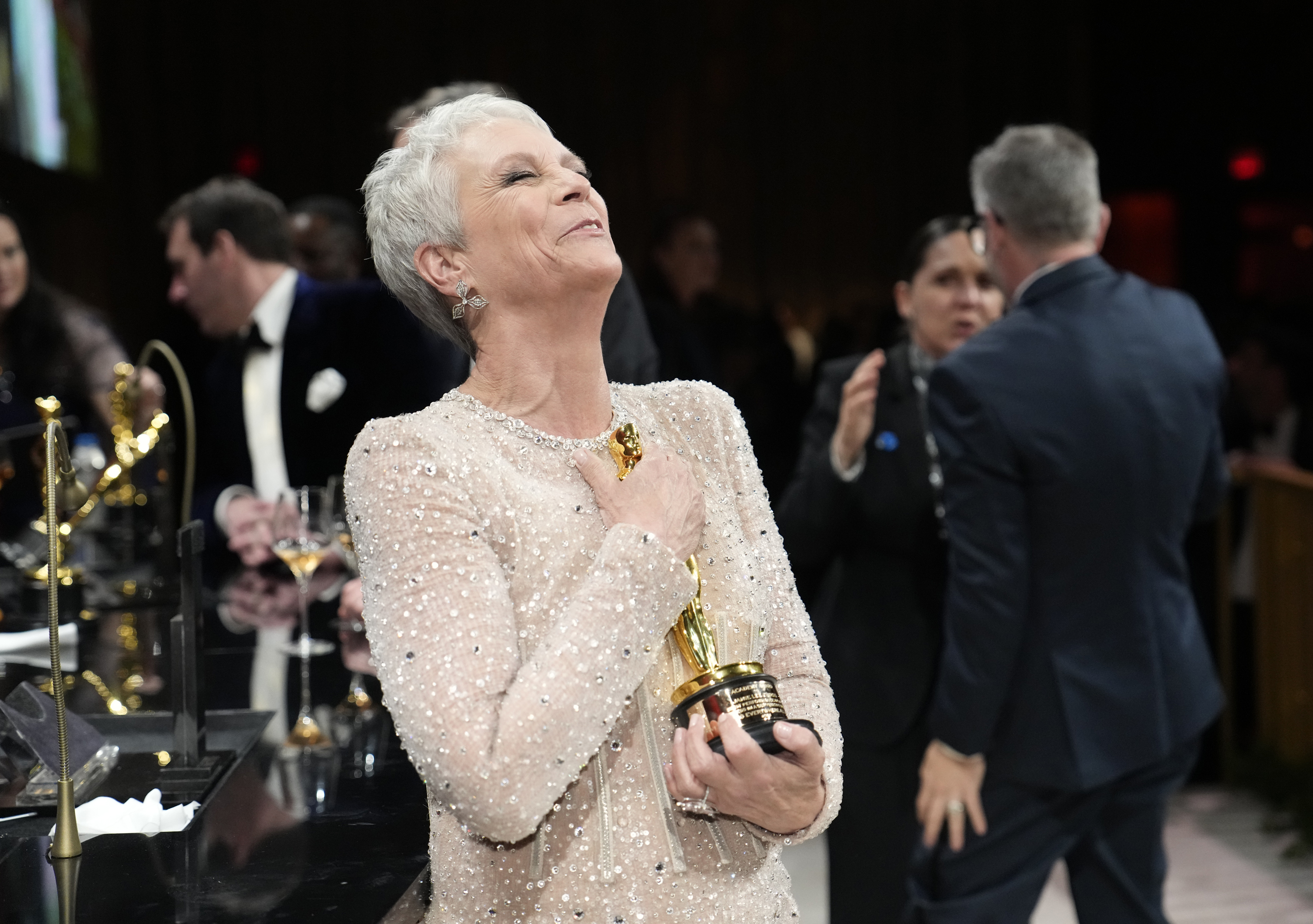 Jamie Lee Curtis hugs her Oscar