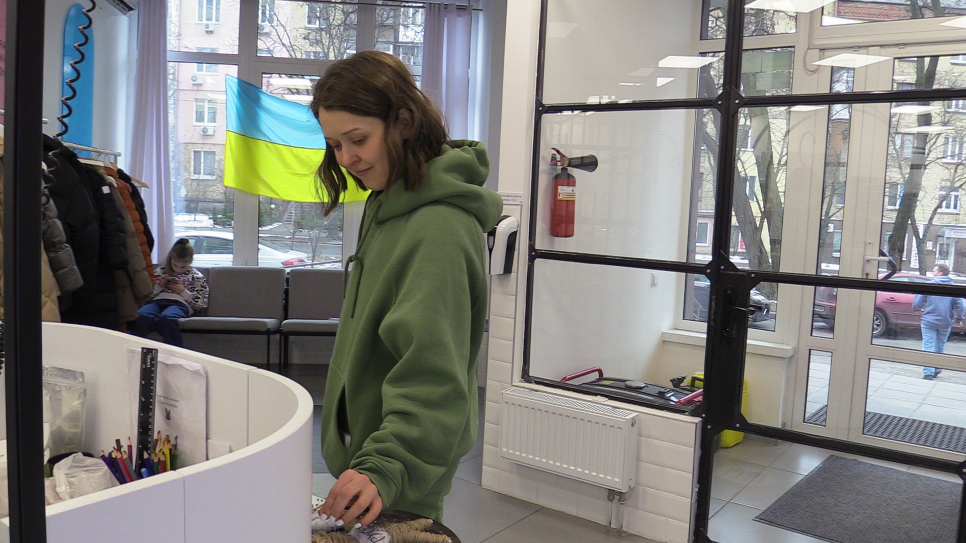 Antonina Krolivets sticks a needle into a voodo doll depicting a Russian serviceman