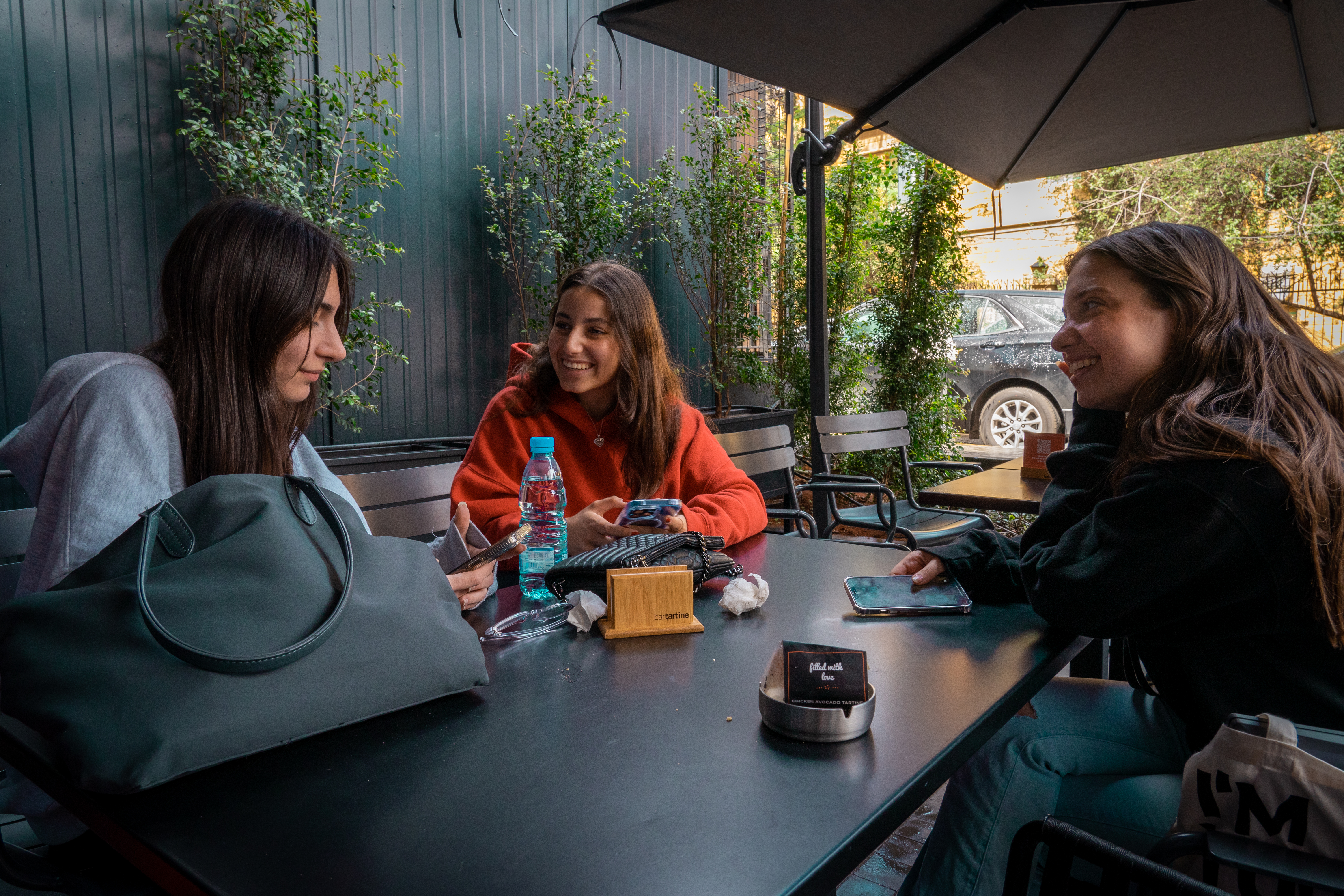 Three women at a coffee table