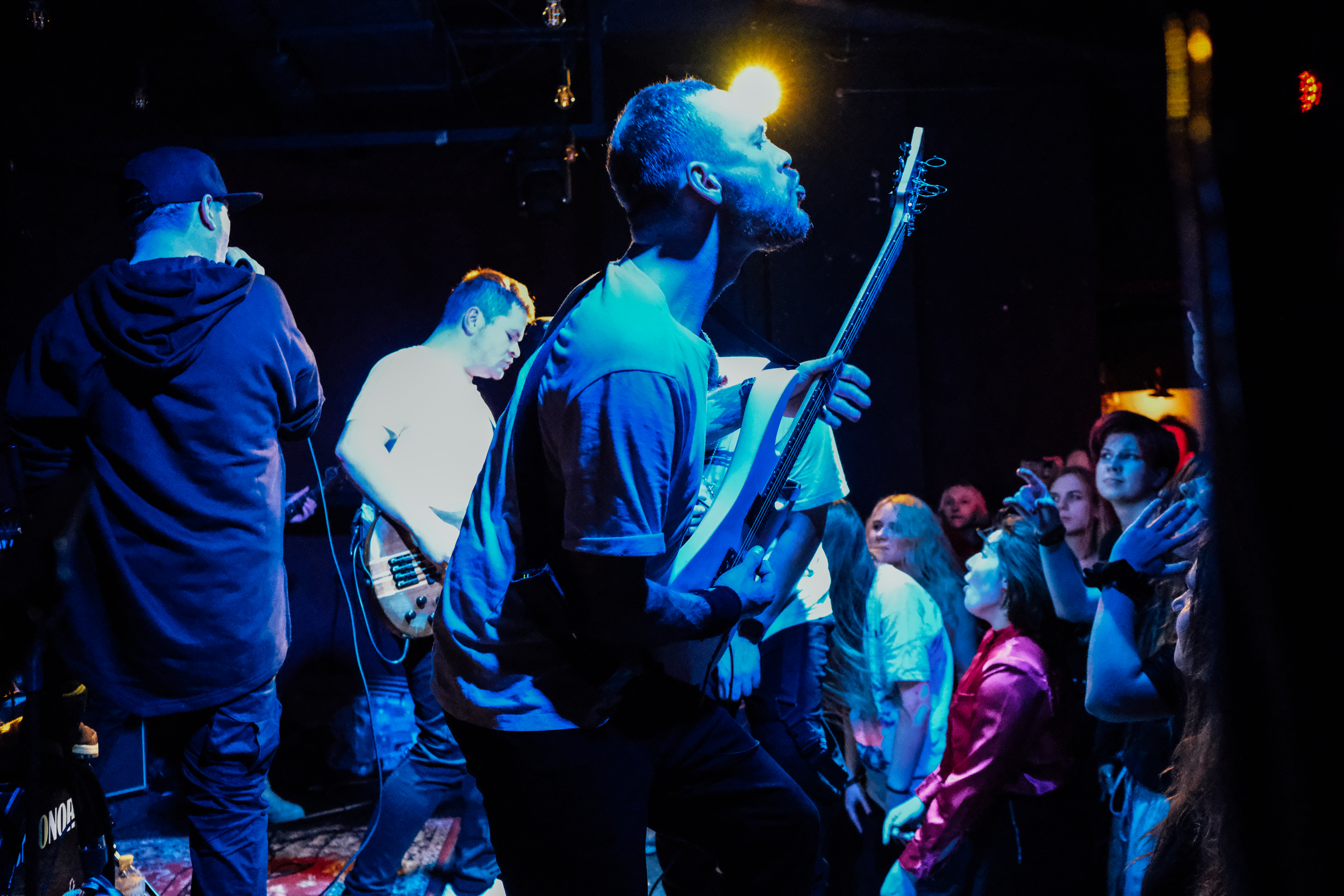 A photo of a band performing on stage.