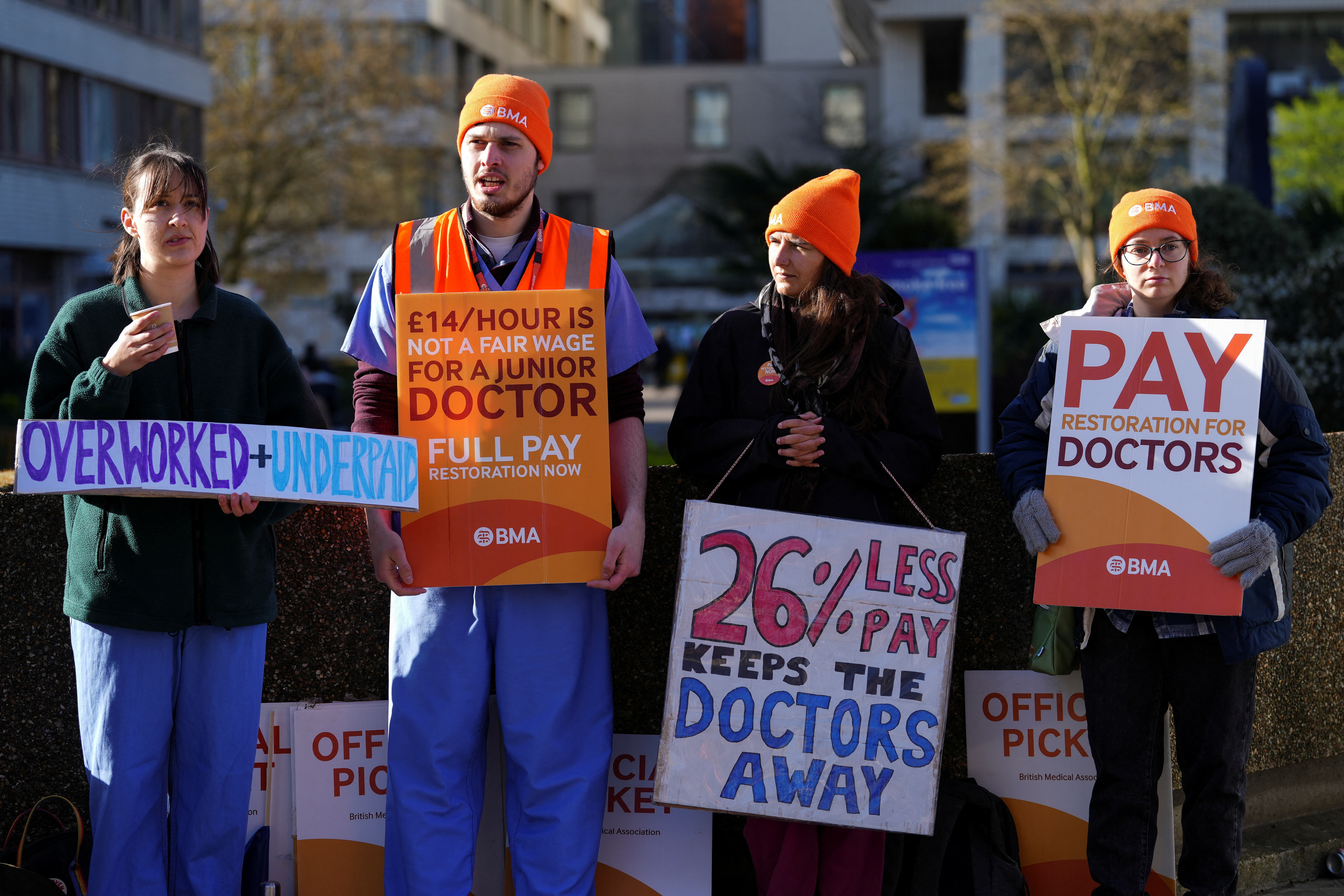 Junior doctors hold placards during a strike in London.