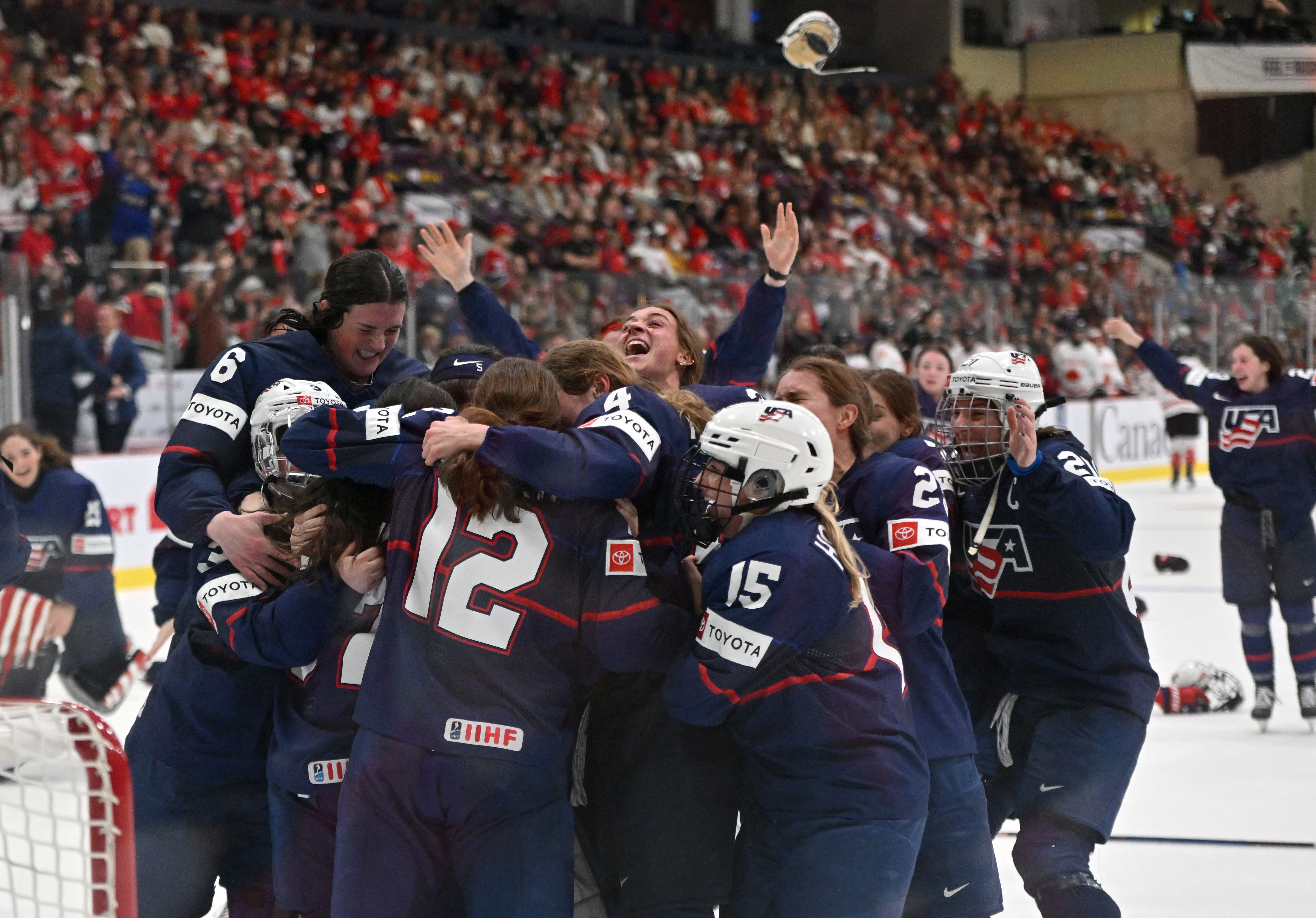 USA ice hockey players celebrate after defeating Canada