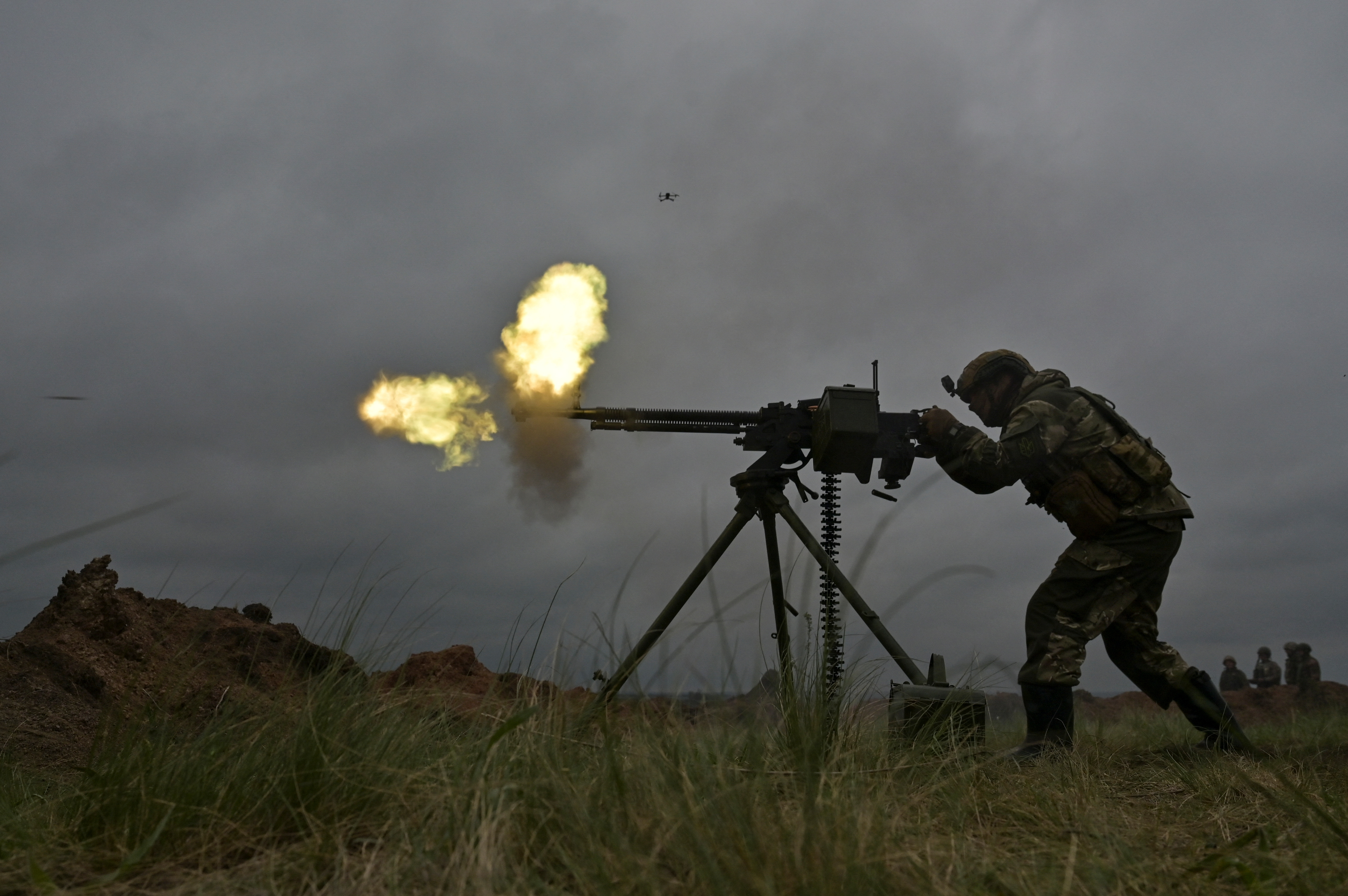 A Ukrainian service member fires a DShK machine gun during military drills at a training ground, amid Russia's attack on Ukraine, in Zaporizhzhia region, Ukraine April 28, 2023. REUTERS/Stringer