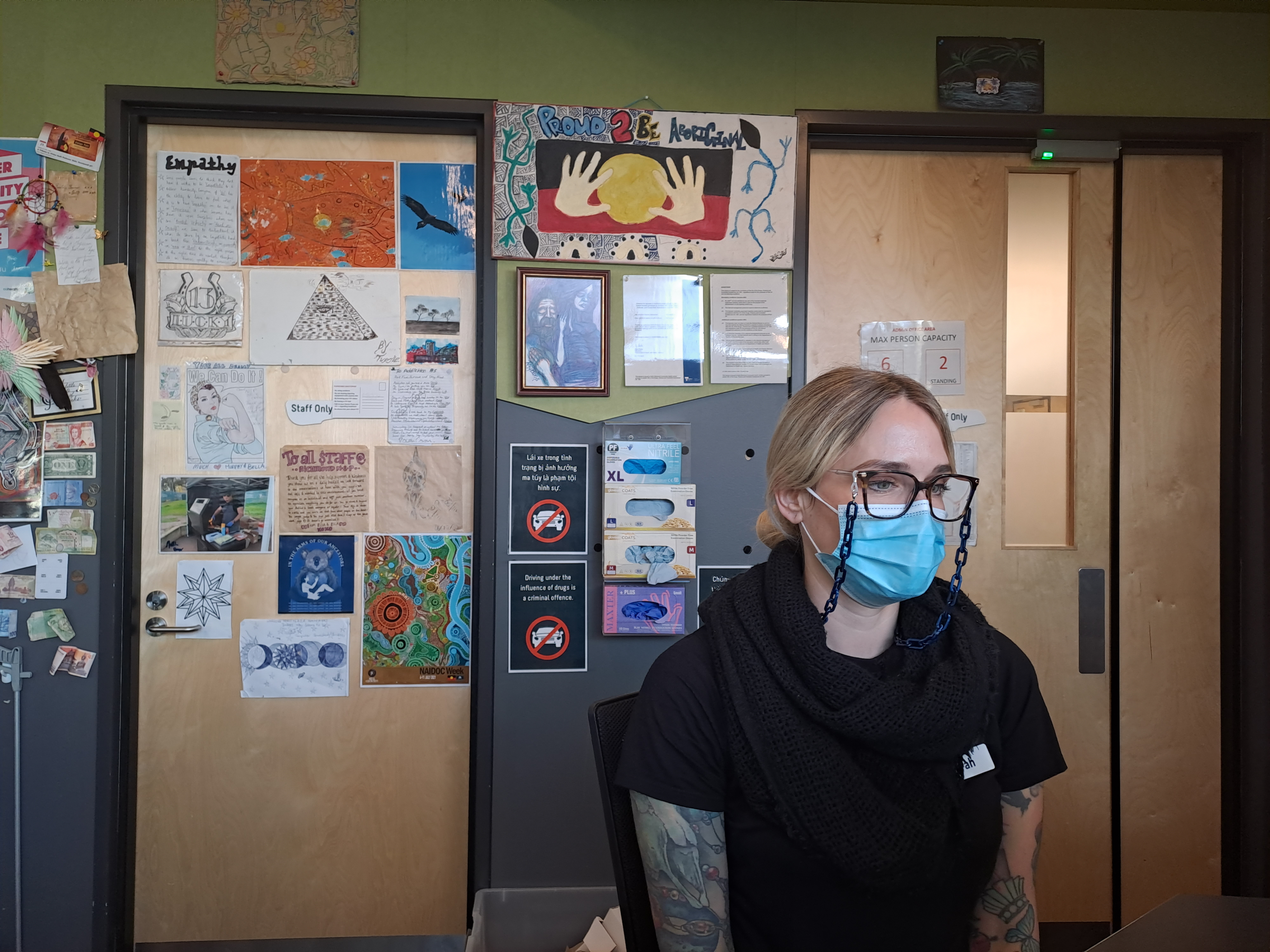 A staff member at the reception in the MSIR in Melbourne's North Richmond Community Health Centre - the country's first medically supervised facility for safe drug injection [Sen Nguyen/Al Jazeera]