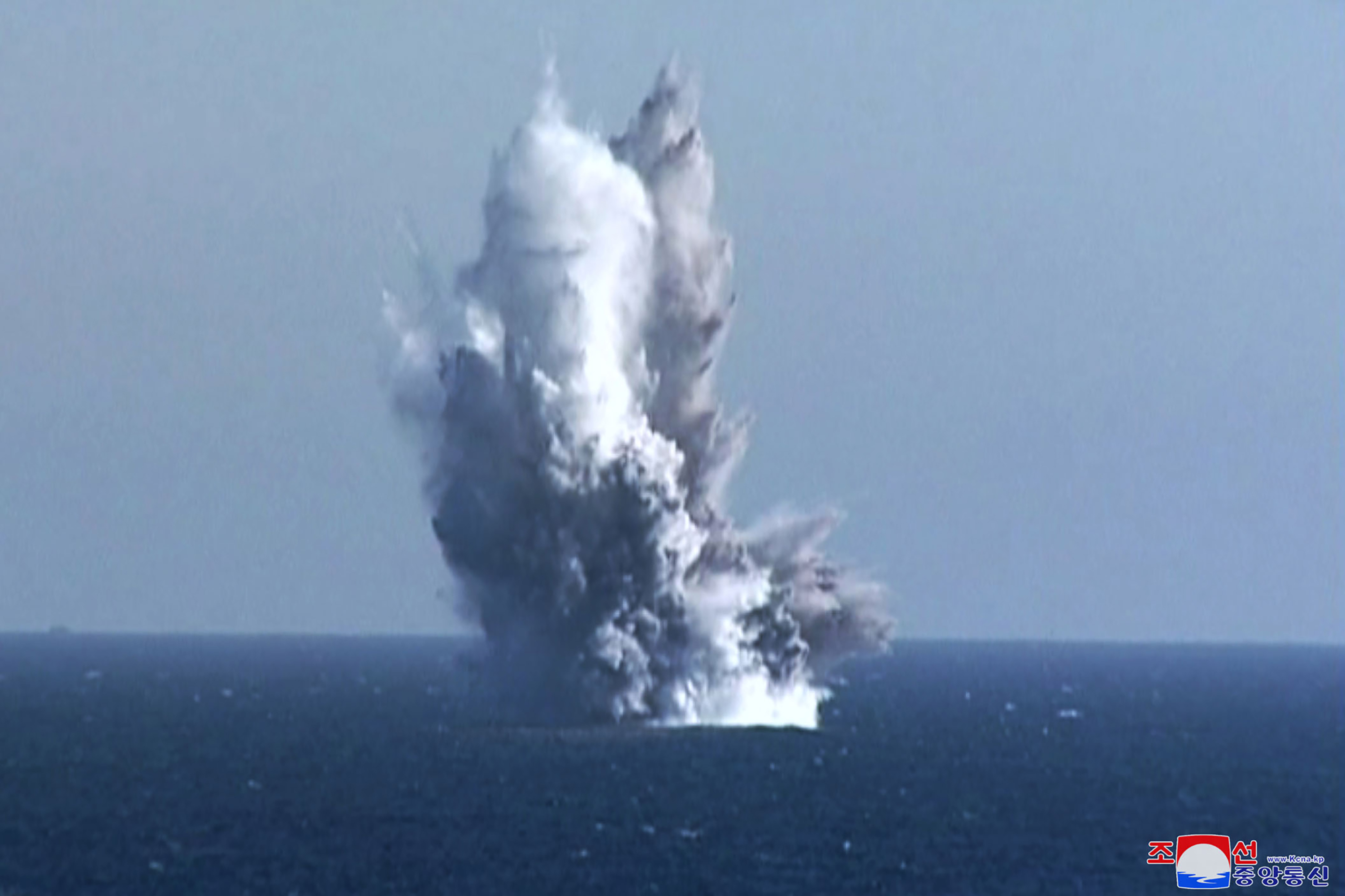 Plumes of water and smoke in the air after an underwater explosion in the sea off North Korea