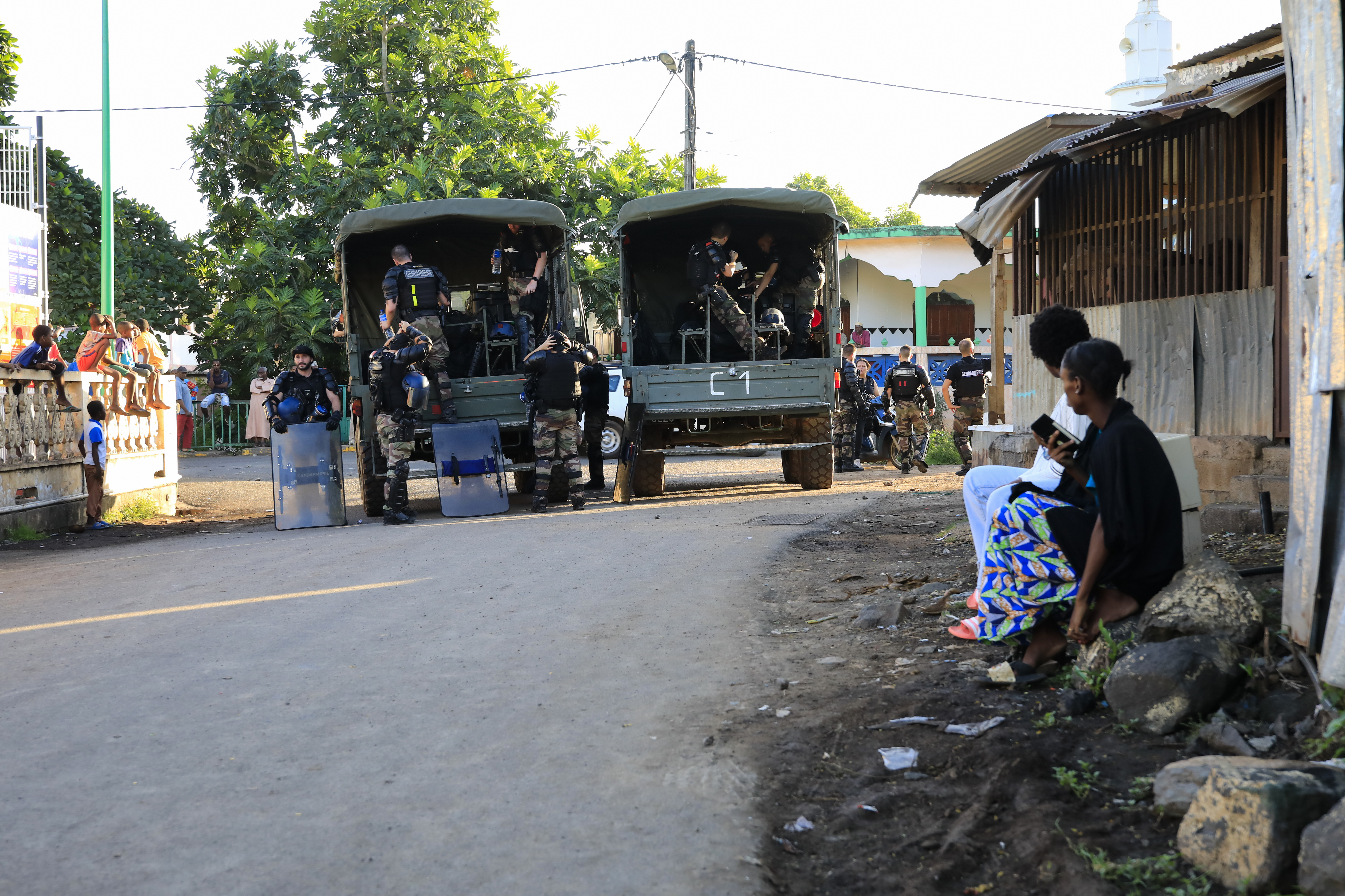French gendarmes patrol in a street after clashes broke out in Majicavo, a commune part of Koungou city, Mayotte on April 25, 2023