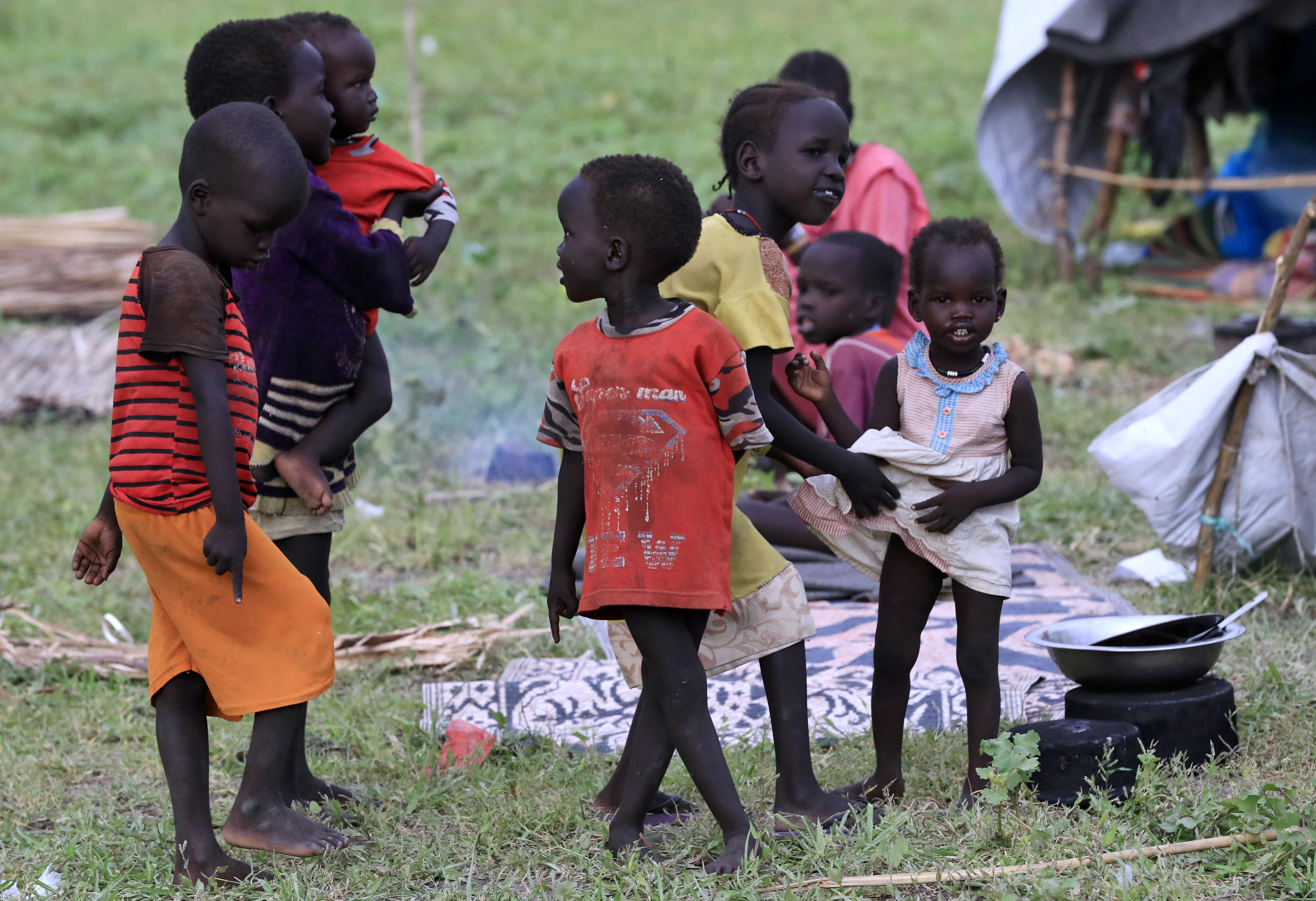 Small children playing at a refugee camp