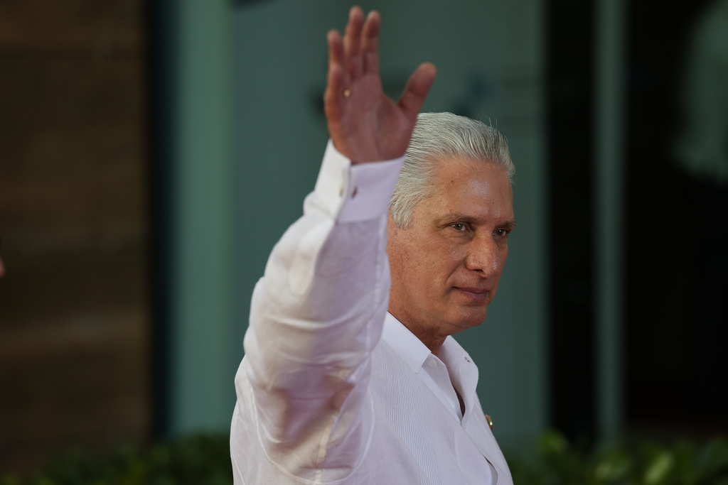 Cuban President Miguel Diaz-Canel waves to onlookers