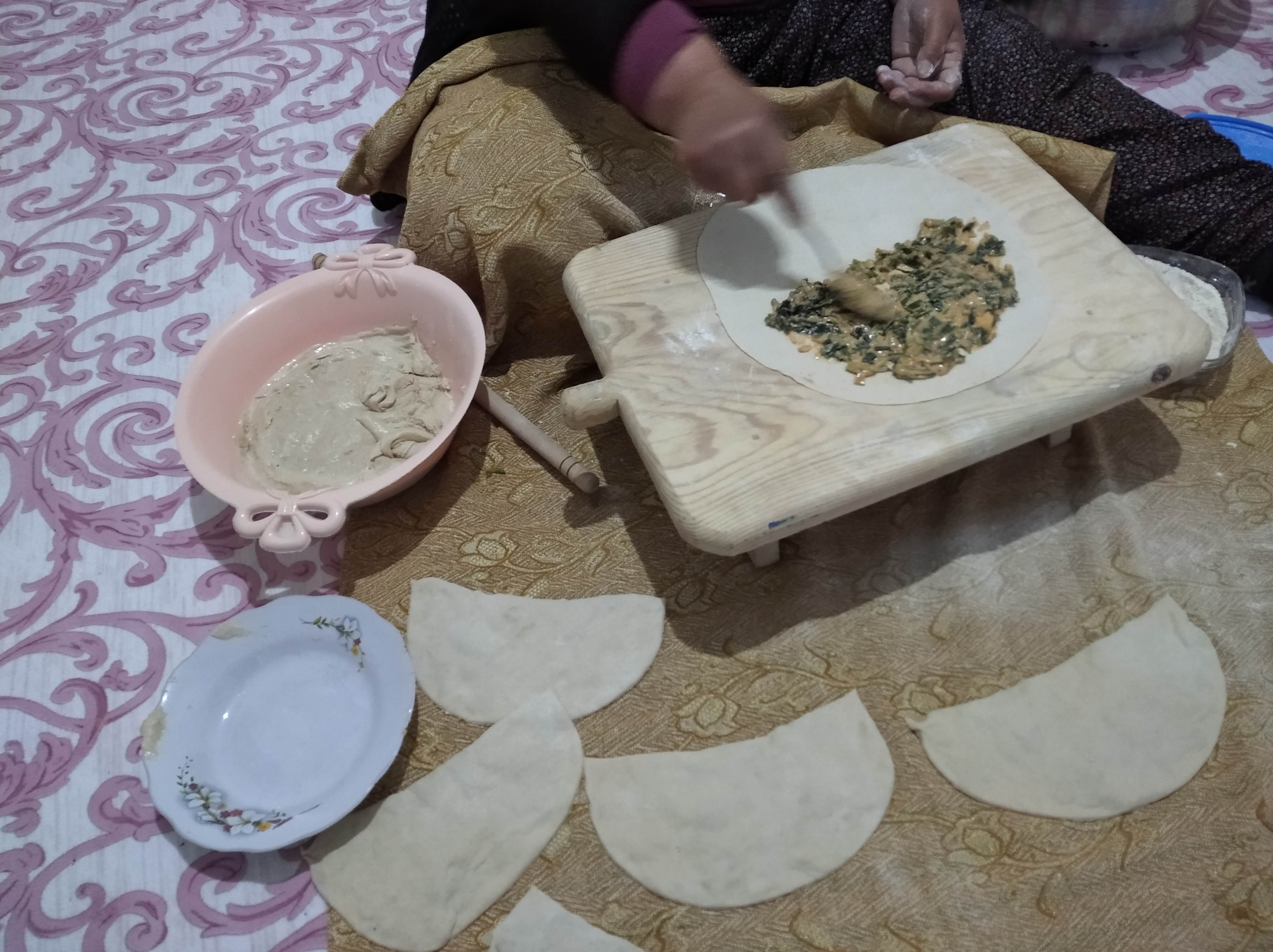Artar prepares gozleme in her kitchen.