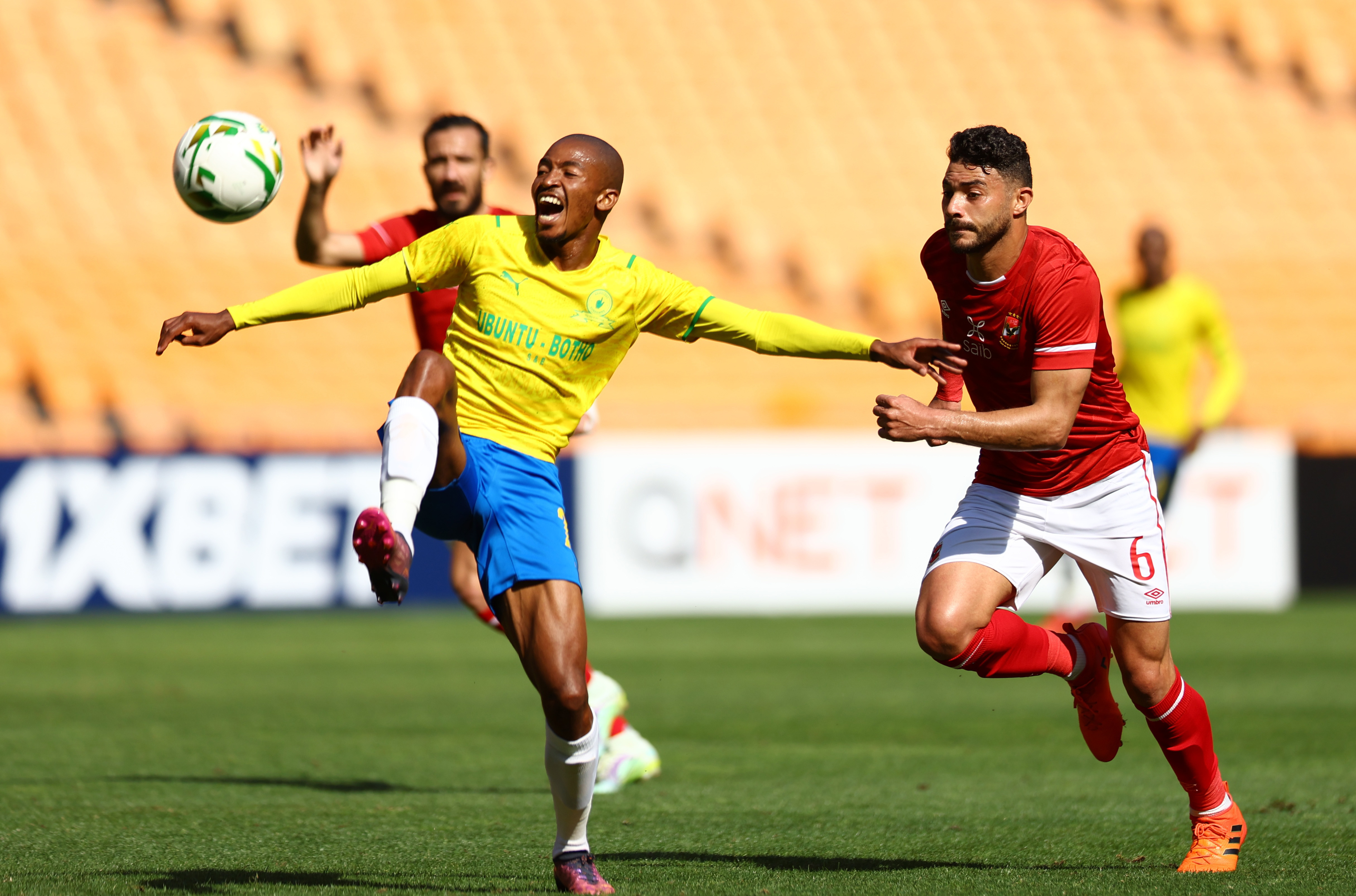 Soccer Football - CAF Champions League - Al-Ahly v Mamelodi Sundowns - FNB Stadium, Johannesburg, South Africa - March 12, 2022 Mamelodi Sundowns' Lyle Lakay in action with Al-Ahly's Yasser Ibrahim REUTERS/Siphiwe Sibeko