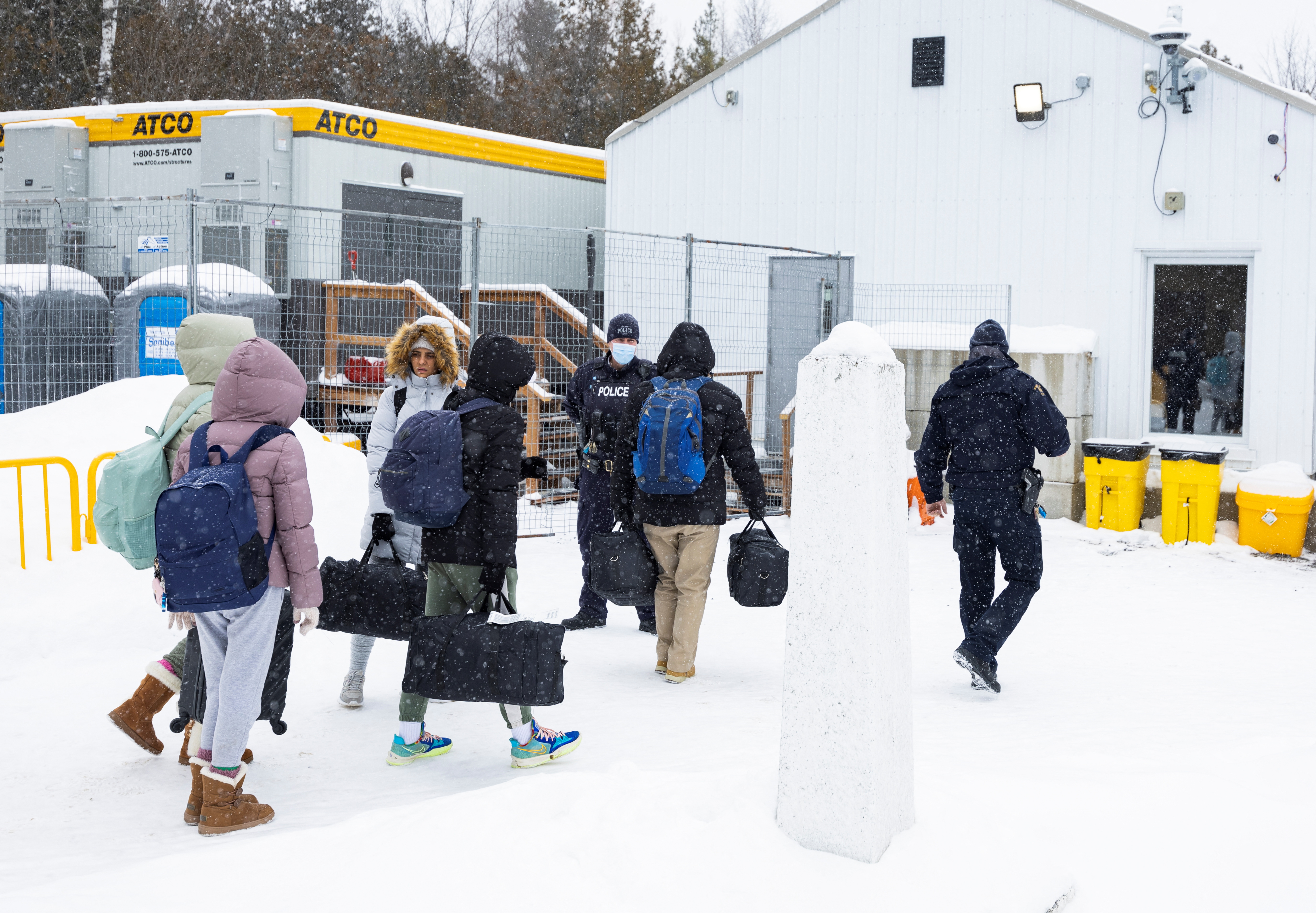 Asylum seekers cross into Canada from the U.S. border on Roxham Road in Champlain, New York, U.S., February 25, 2023