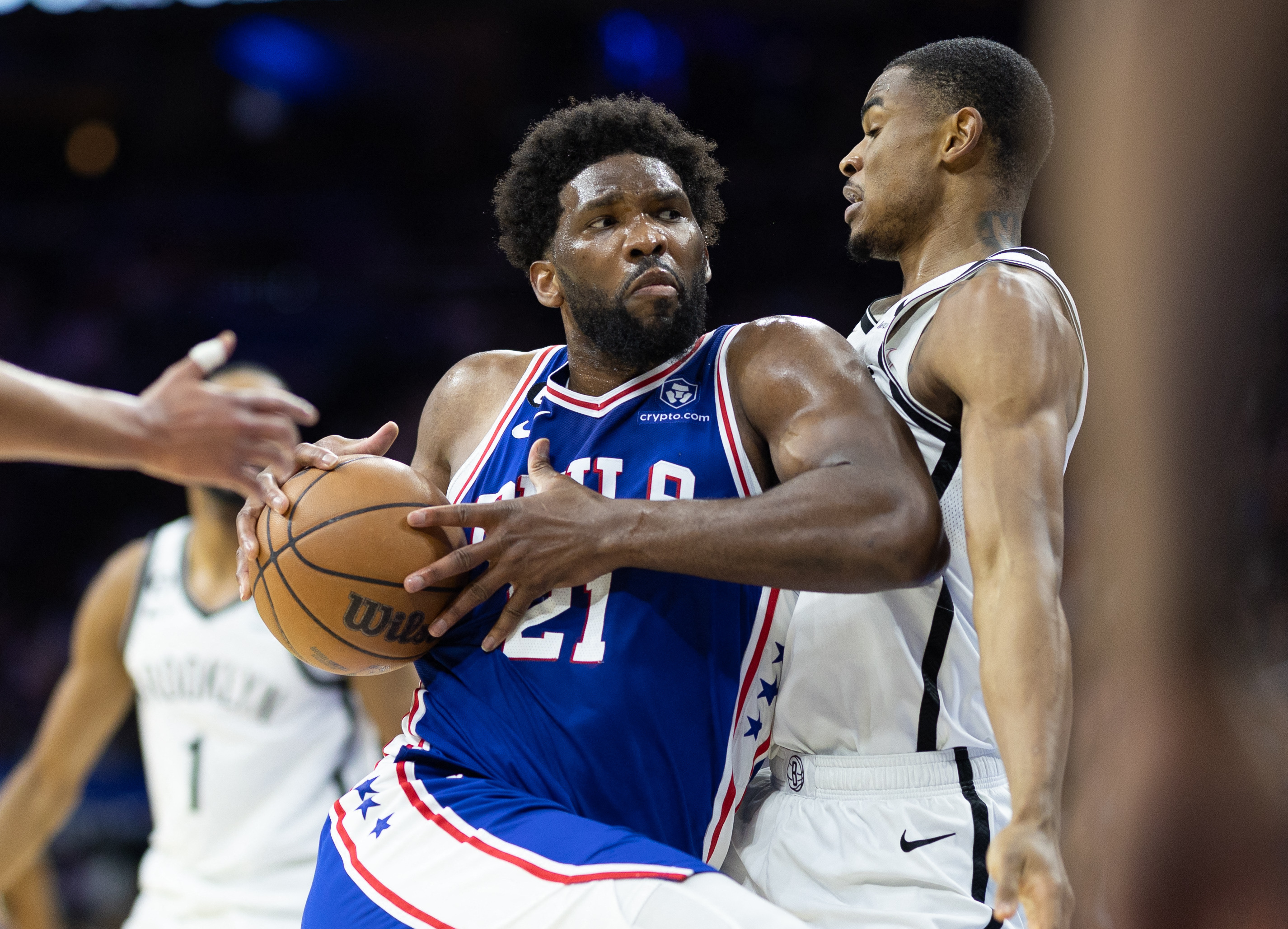 Joel Embiid (21) drives against Brooklyn Nets center Nic Claxton