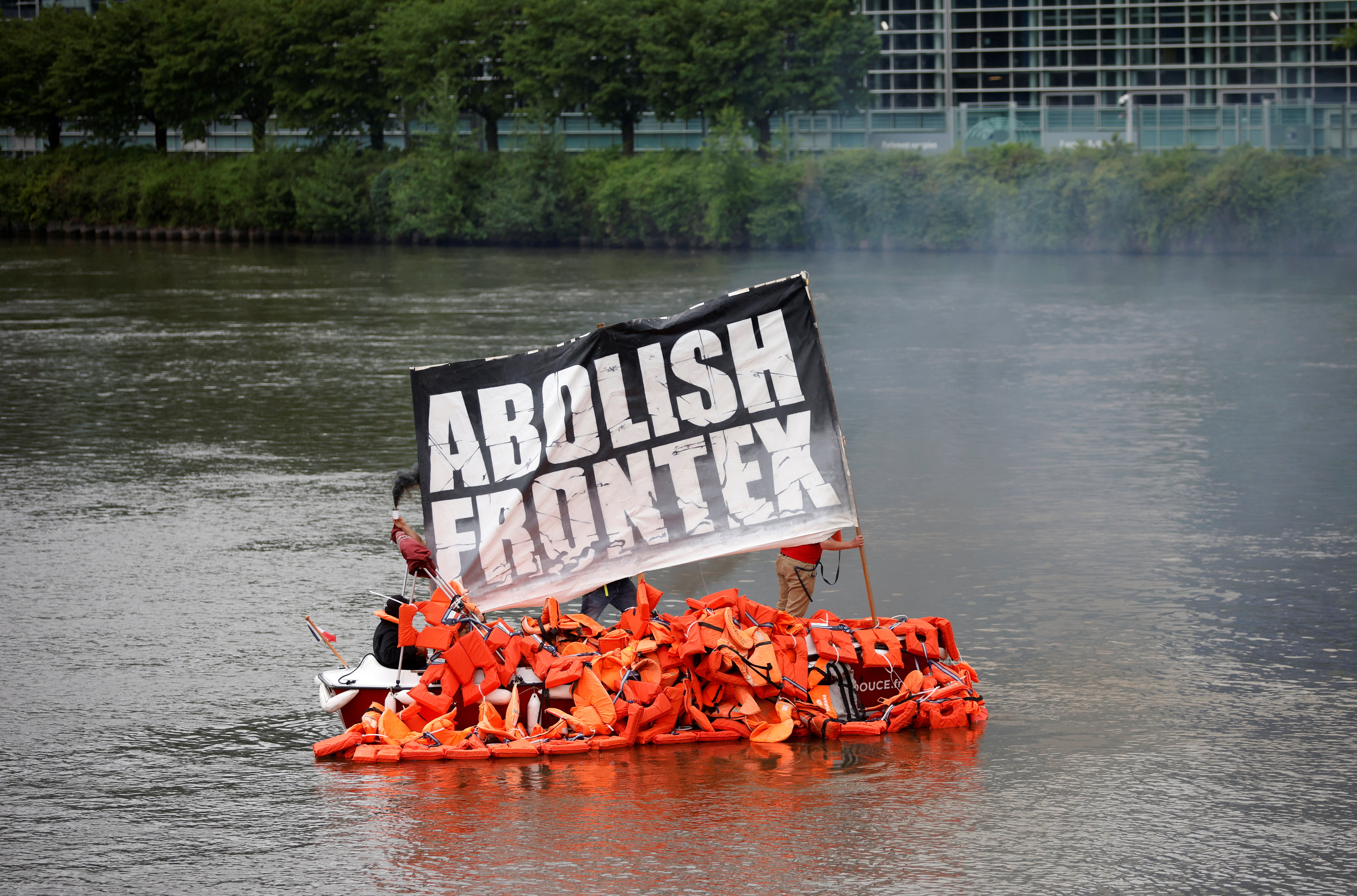 Members of German NGO migrant rescue Sea-Watch and art Kollektiv Ohne Namen sail a boat with life vests during a symbolic art action to bring attention to the plight of refugees crossing the Mediterranean Sea