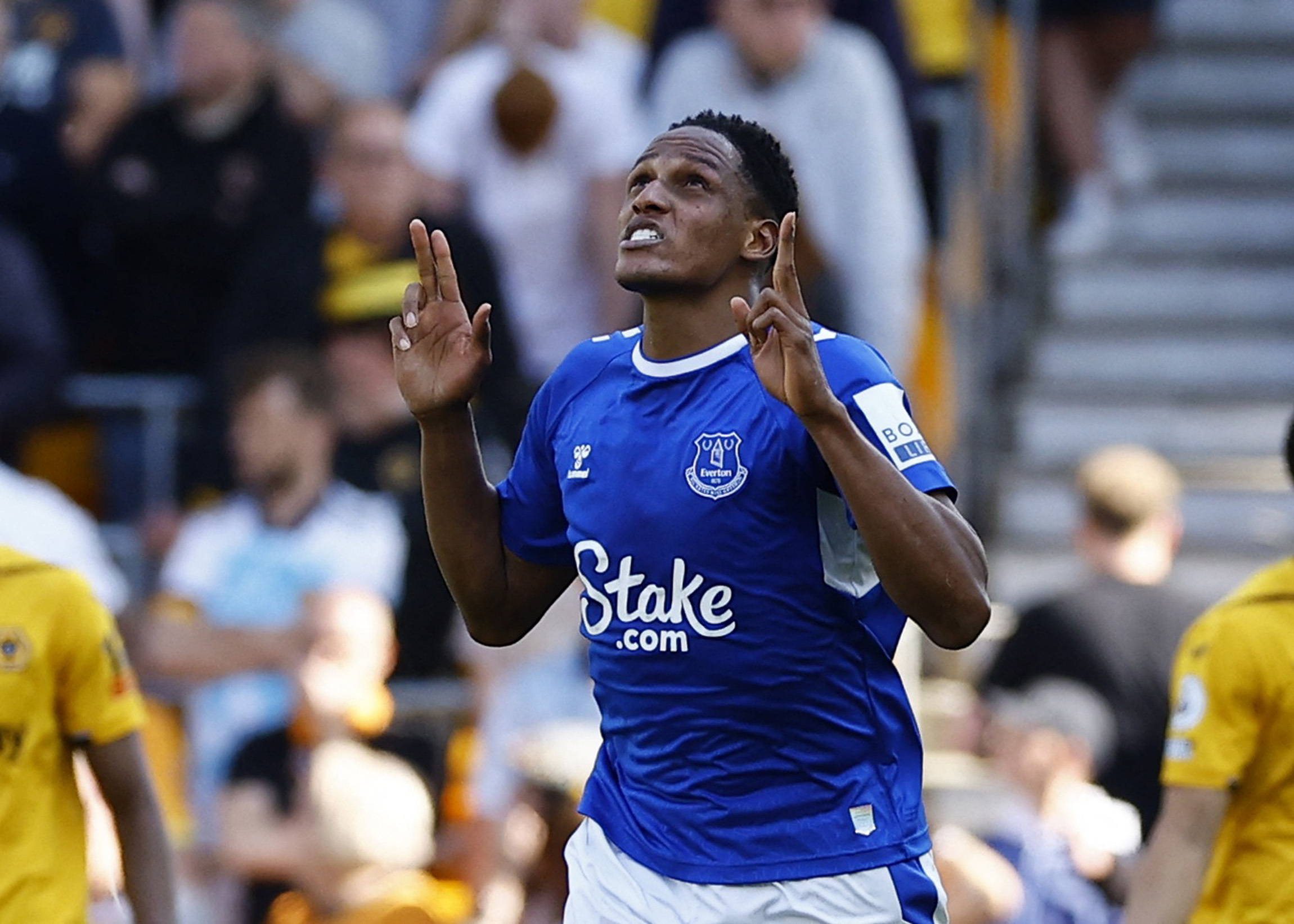 Everton's Yerry Mina looks and points up to the sky as he celebrates scoring a goal