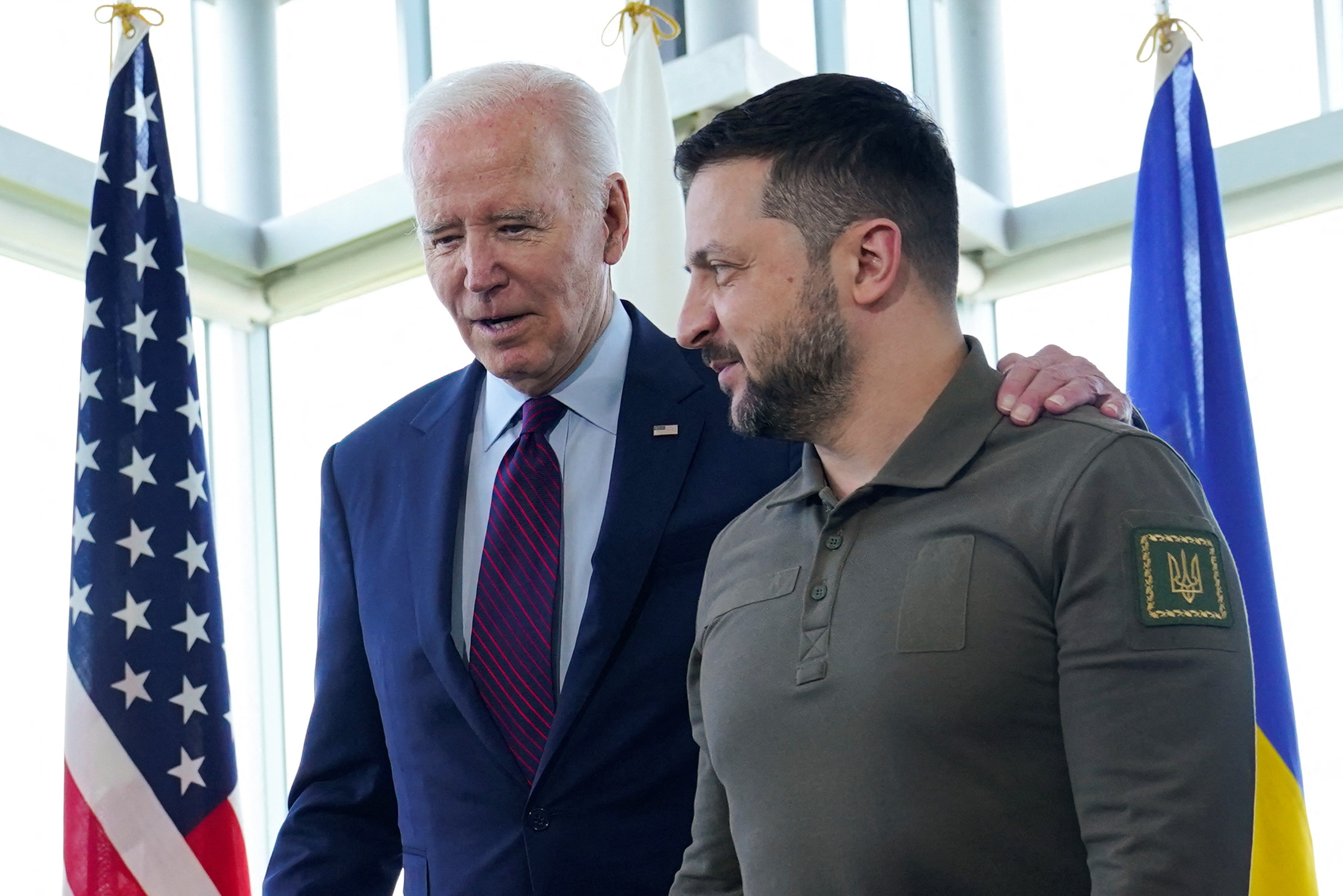President Joe Biden, walks with Ukrainian President Volodymyr Zelenskiy ahead of a working session on Ukraine during the G7 Summit in Hiroshima, Japan, Sunday, May 21, 2023. Susan Walsh/Pool via REUTERS