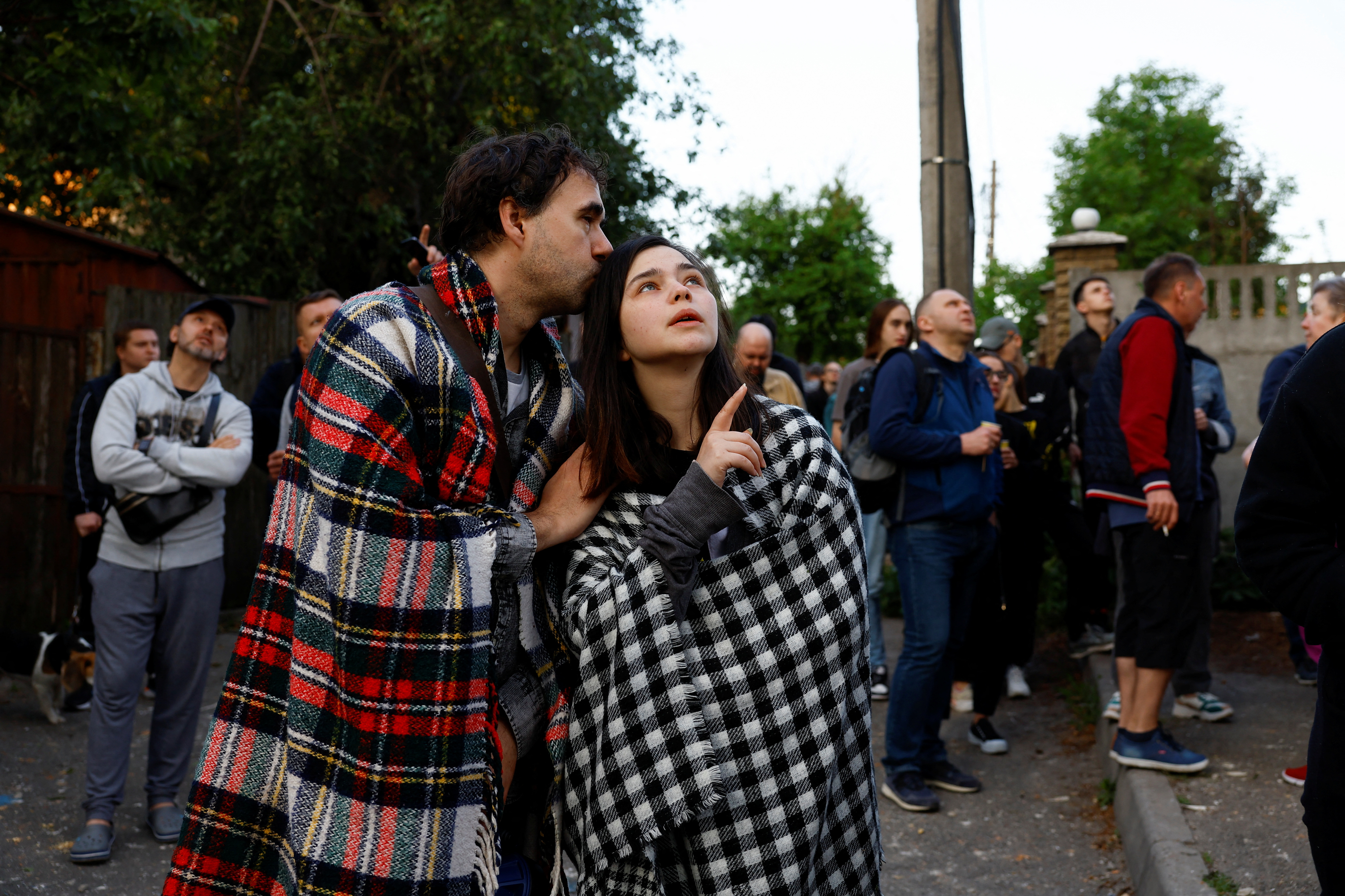 Residents react after a massive Russian drone strike