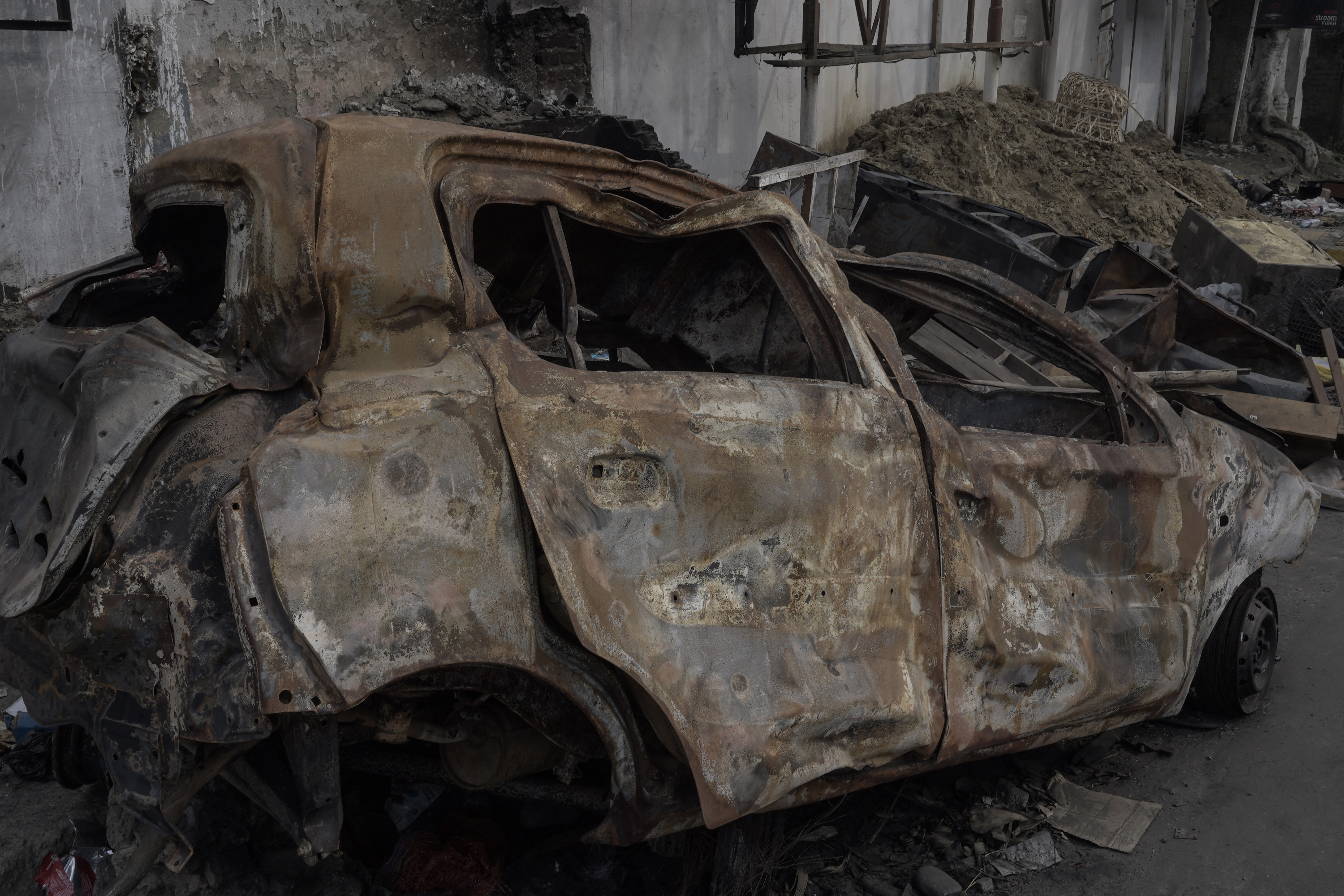 A vehicle torched at a road in Churachandpur district