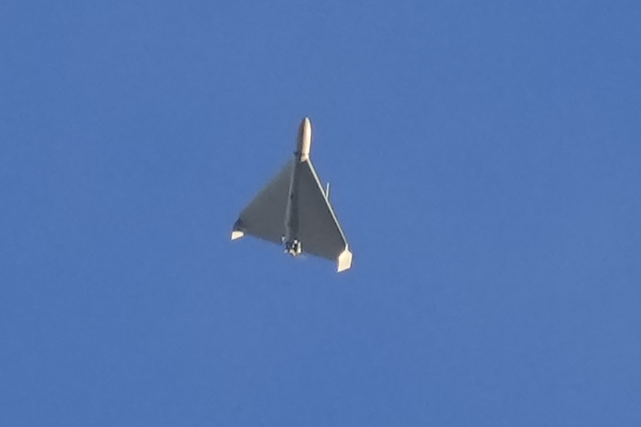 A drone against a blue sky sky seconds before it fired on buildings in Kyiv, Ukraine, on Oct. 17, 2022.
