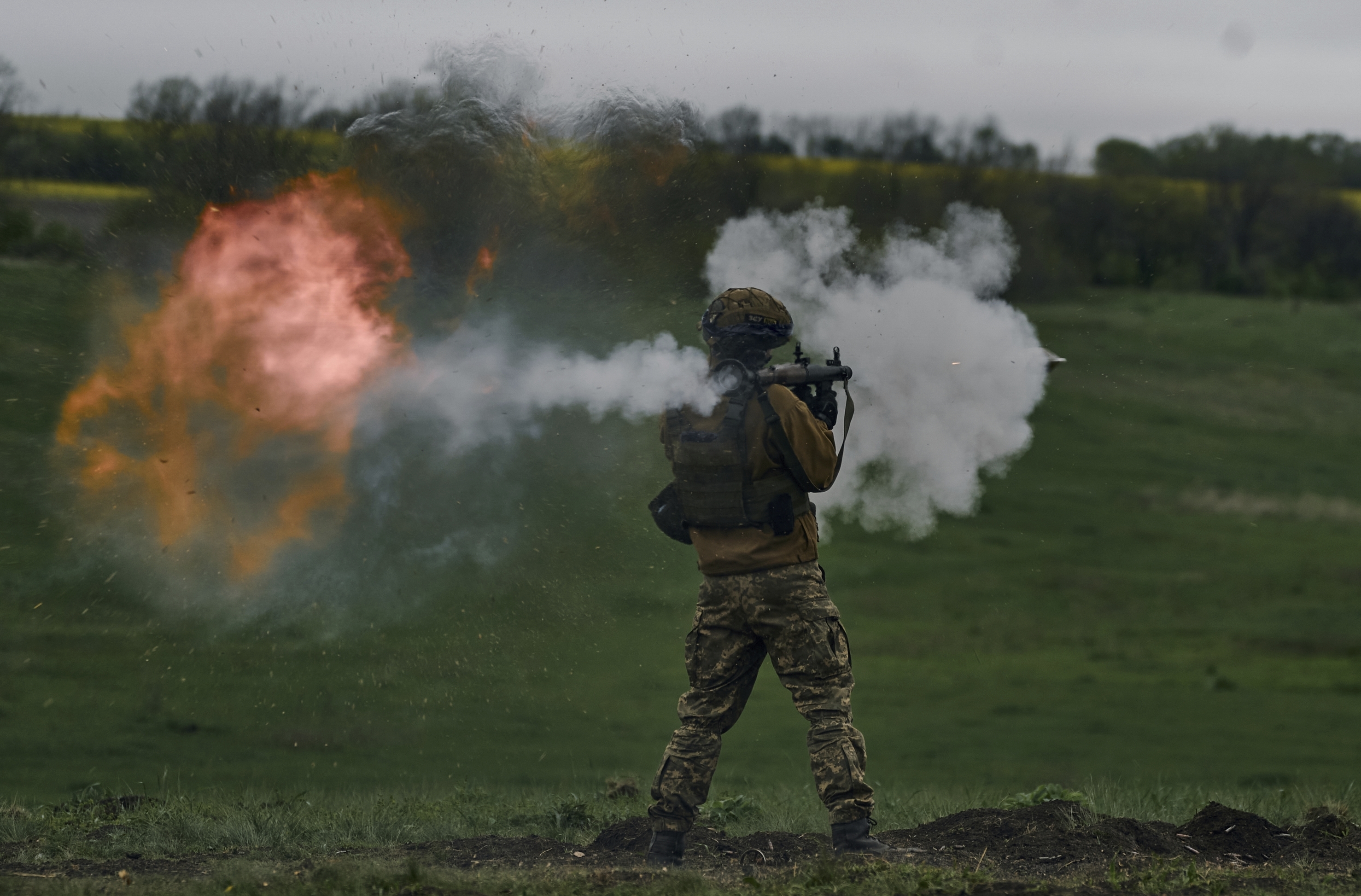 A Ukrainian soldier fires an RPG during his training at a front-line position near Vuhledar, Donetsk region, Ukraine, Monday, May 1, 2023.