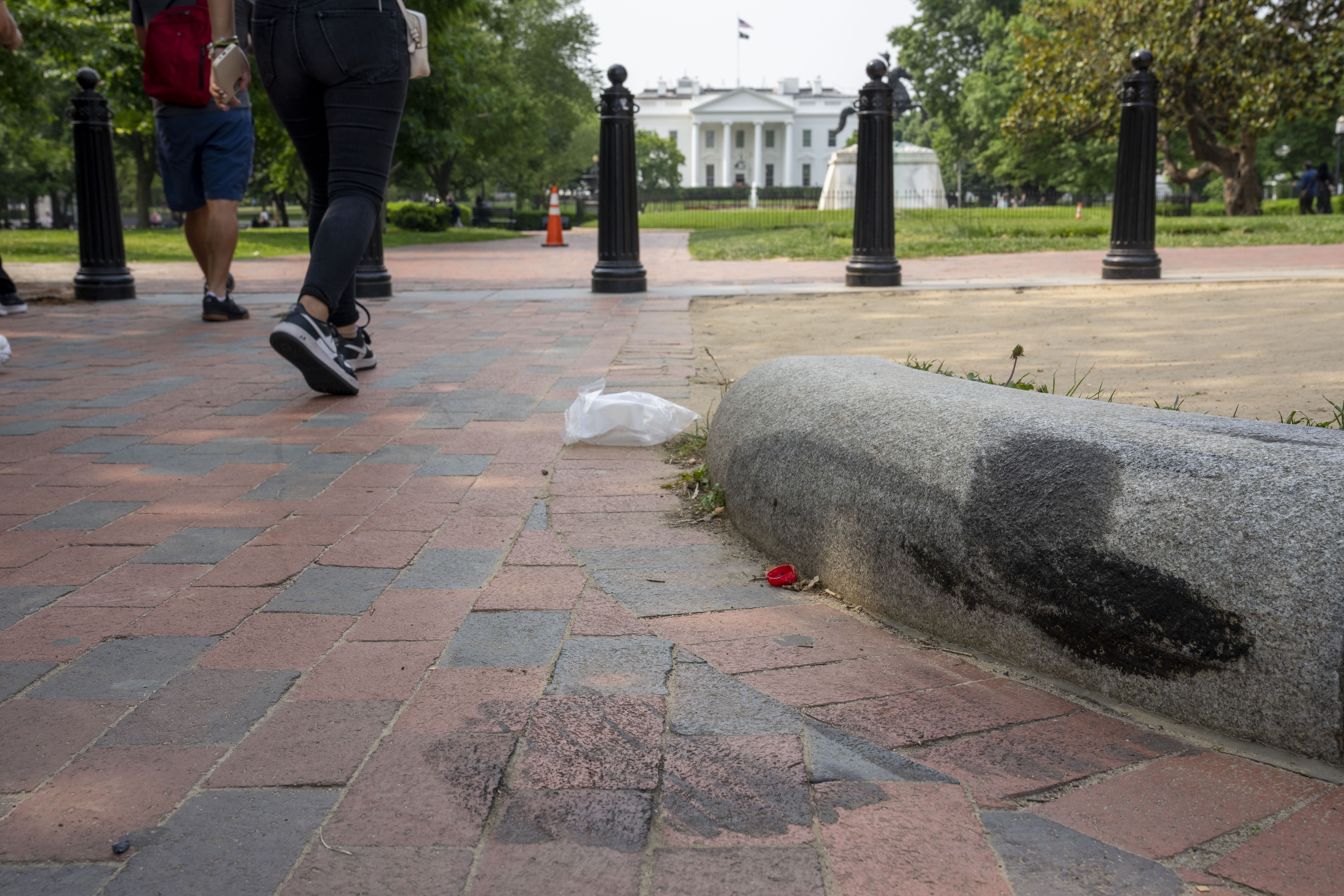 Tire marks remain on a curb in Lafayette Square park near the White House