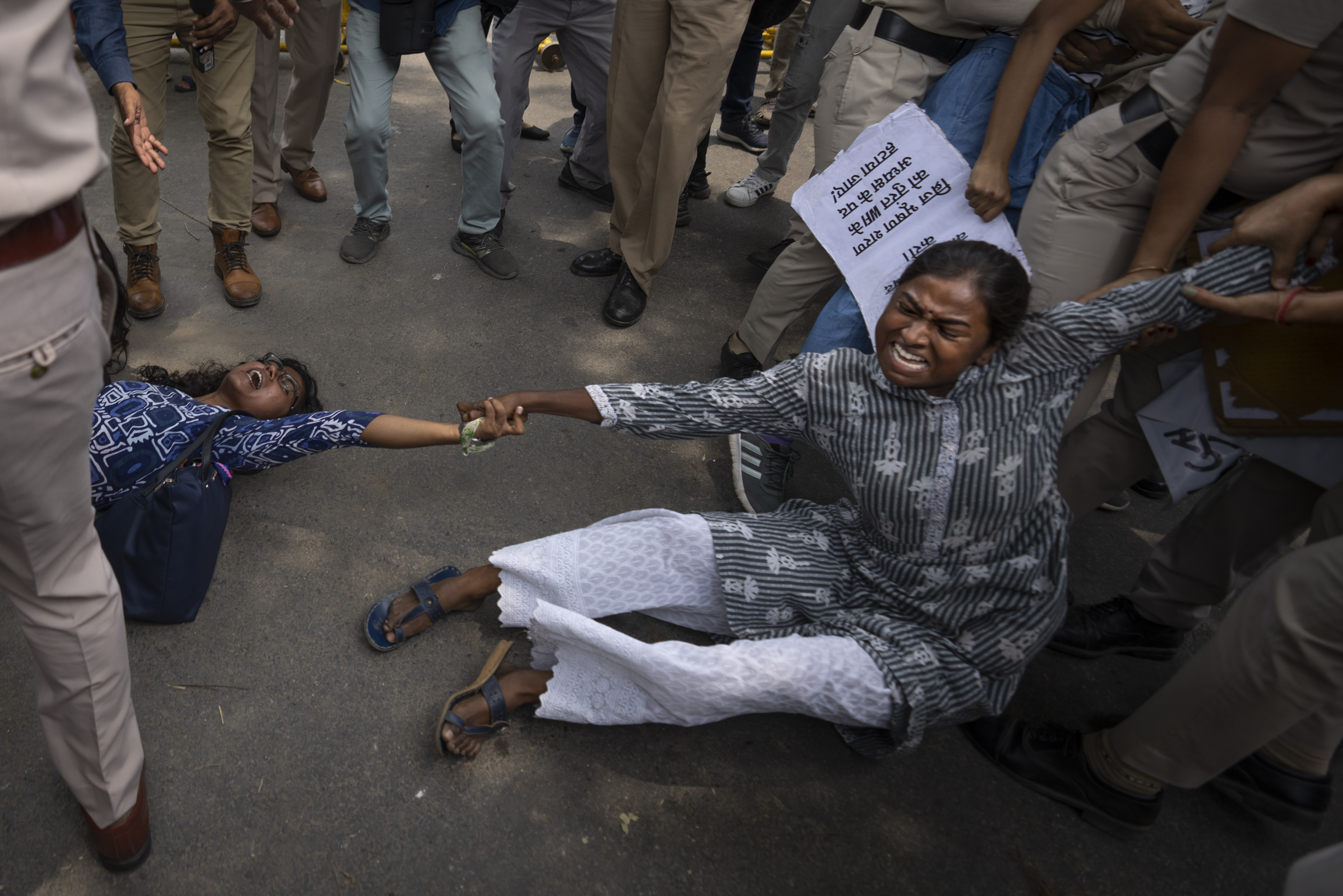 Student activists who had come to support of protesting wrestlers are detained by the police