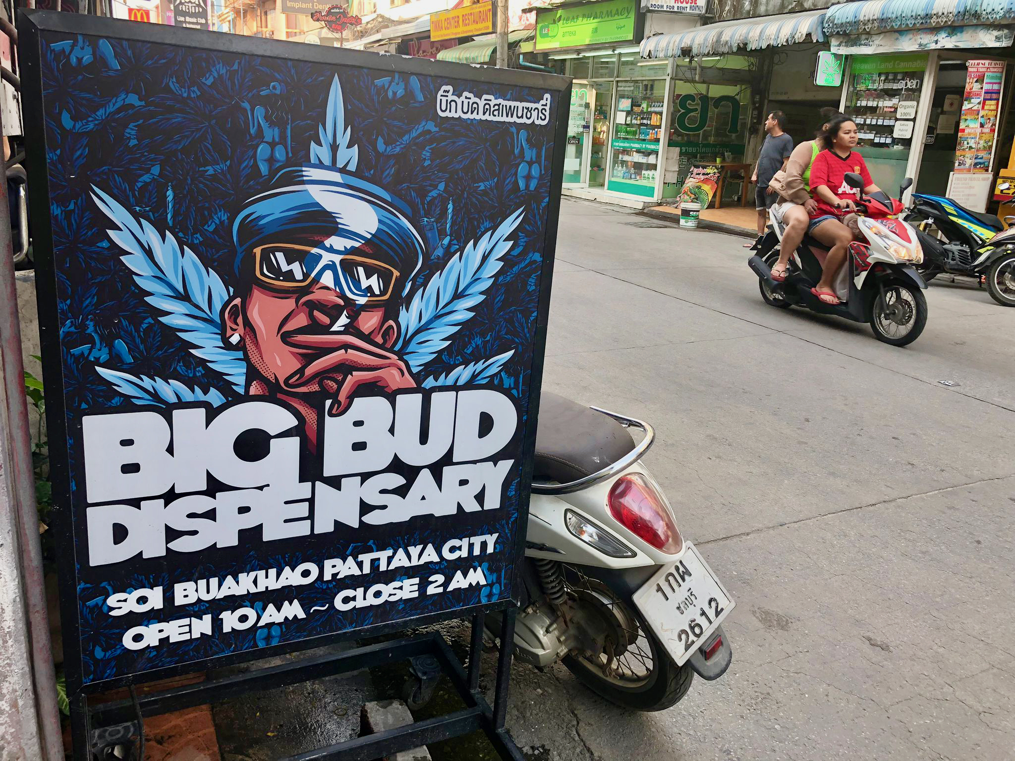 A cannabis dispensary ad along a street in Thailand.