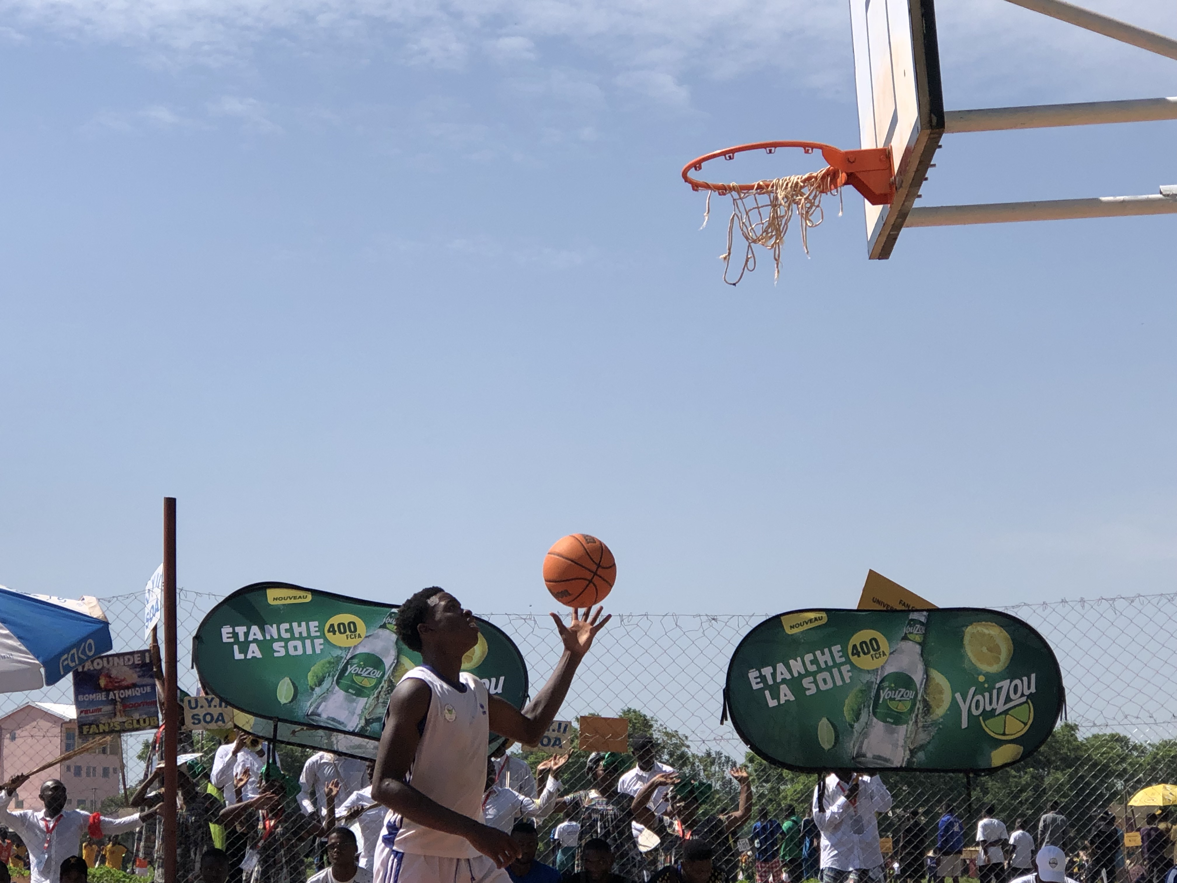 A basketball player about to take a shot underneath the hoop