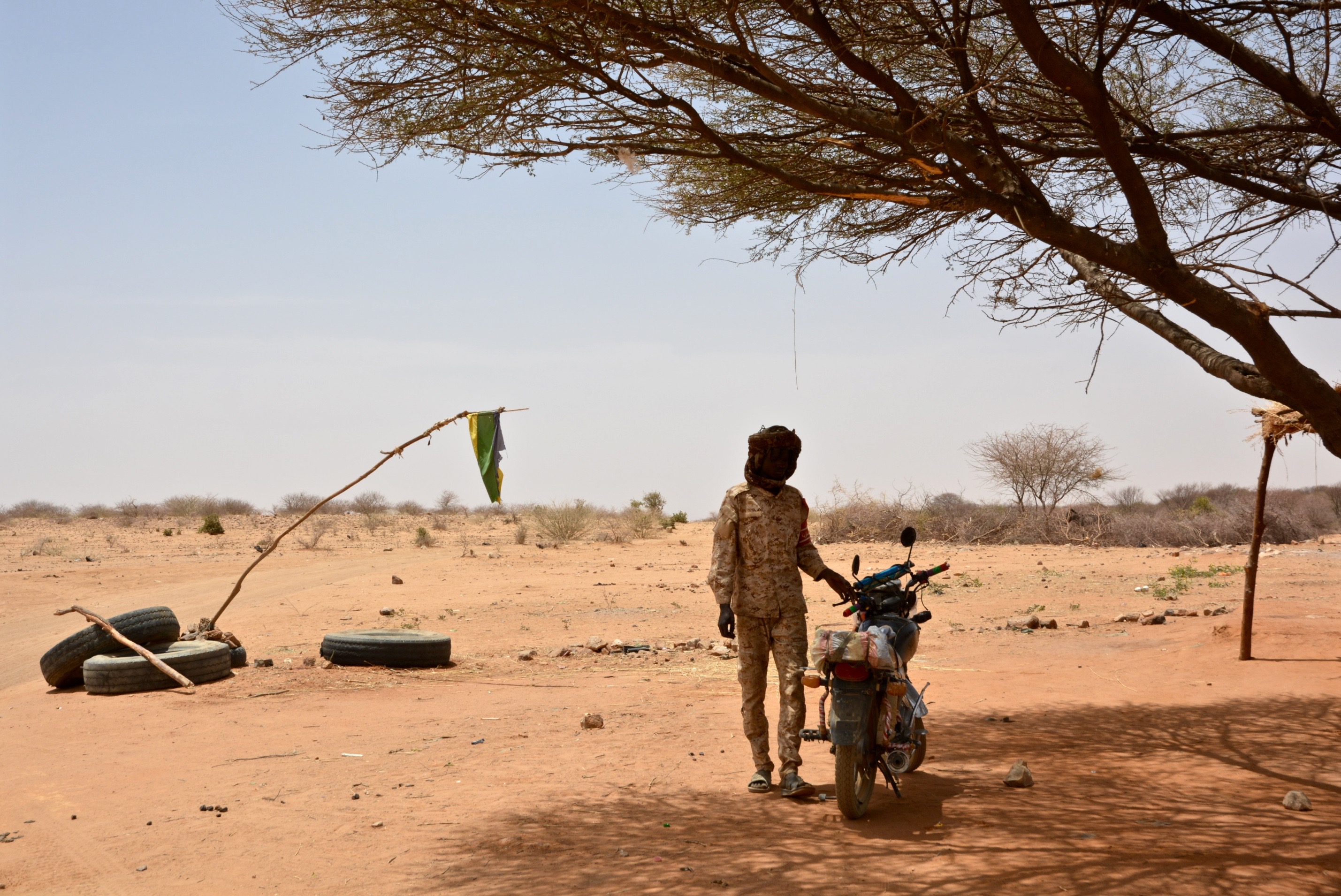 A flag flies at a rebel checkpoint in Sudan
