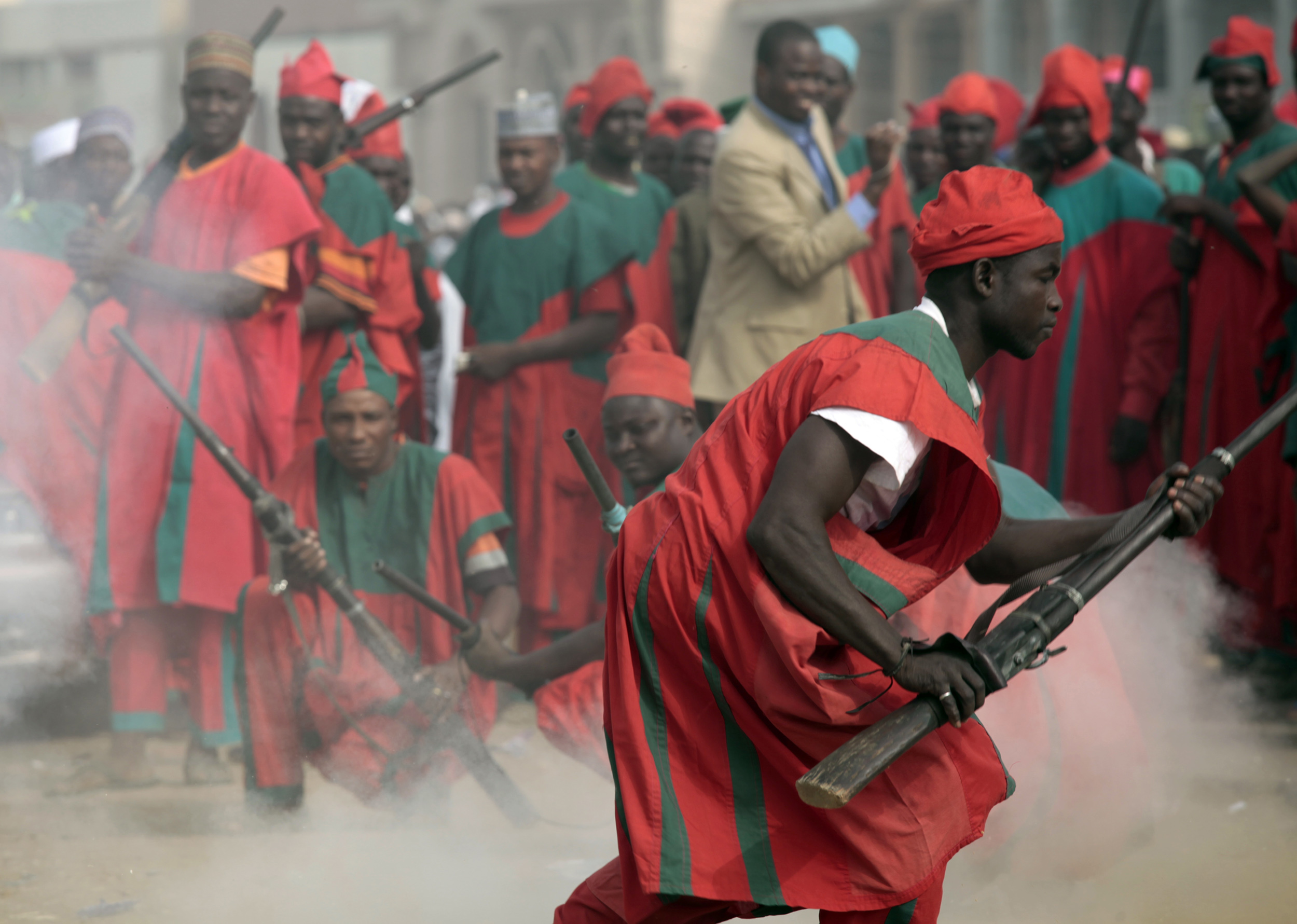 Traditional palace guards of Emir of Kano, Ado Bayero, fire locally made muskets to mark the end of prayers on the first day of the Muslim holiday of Eid al-Adha in Kano